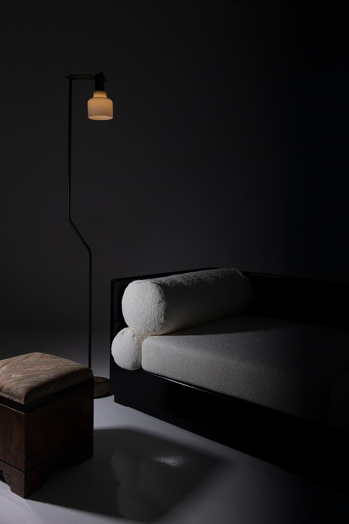 The 1950s Italian floor lamp attributed to the OLUCE manufacture is a beacon of design and functionality, a monument to ingenuity and aesthetics that illuminates not only physical spaces but also those of the imagination. This lamp is like a poem of
