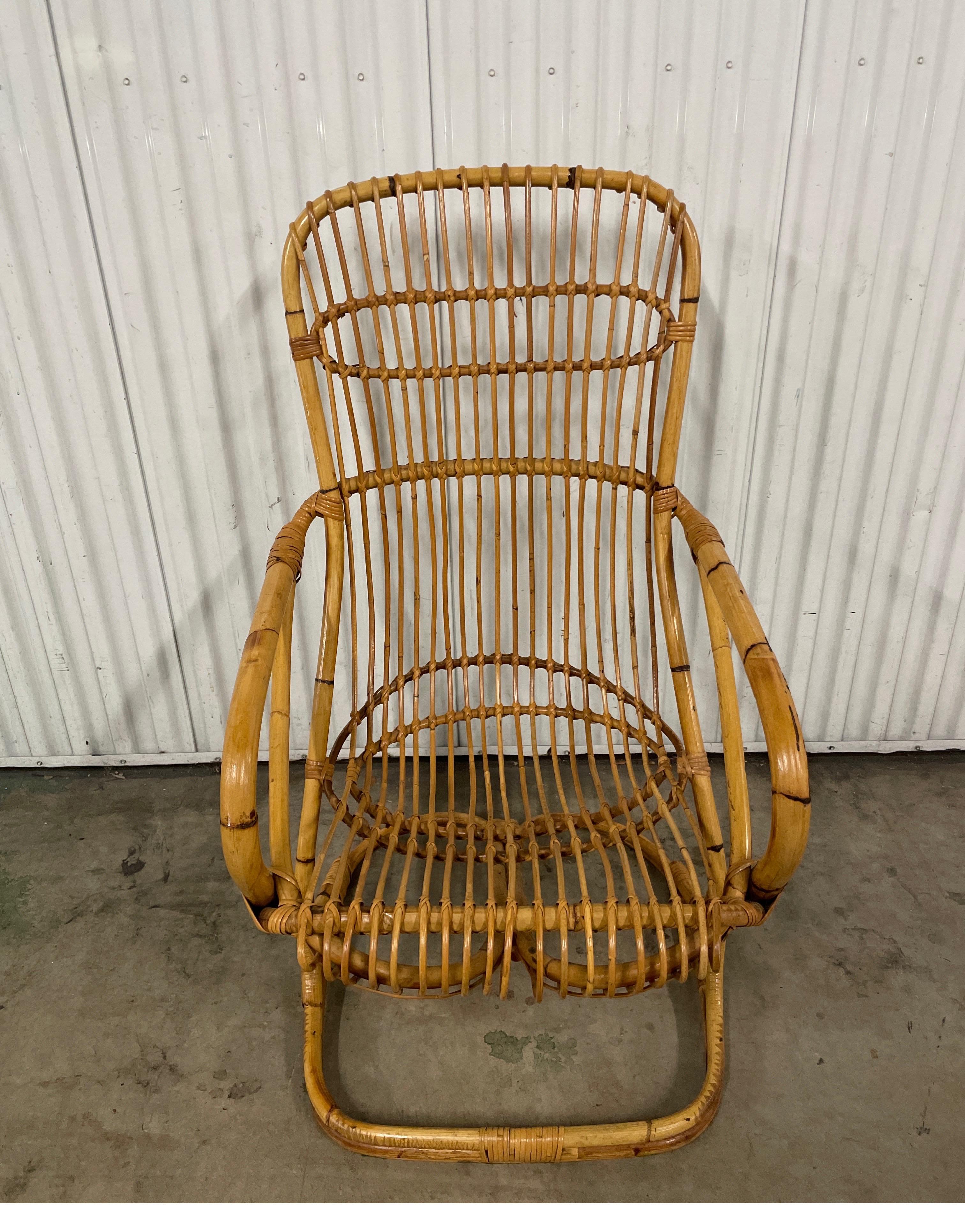 Vintage bent bamboo armchair by Tito Agnoli. A classic chair by this coveted Italian designer.