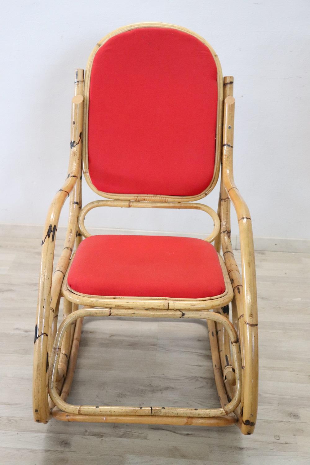 Beautiful vintage and particular rocking chair made of bamboo. Italian production, circa 1980s. Very comfortable with red fabric, perfect for your moments of rest. Perfect conditions.