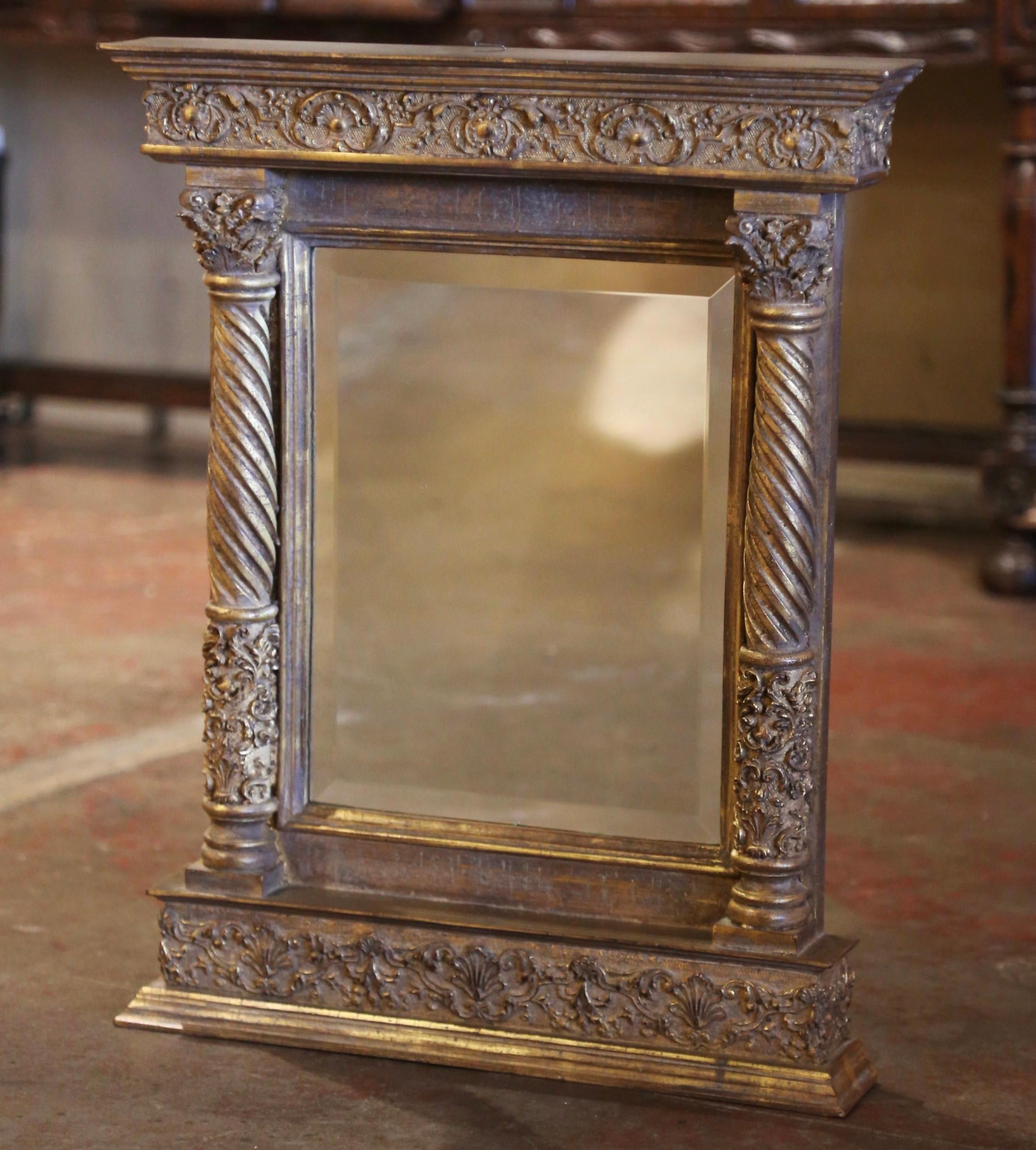 Add a dose of Baroque drama to your home with this elegant gilt and painted mirror! Crafted in Italy, circa 1980, the wall hanging mirror is rectangular in shape, and features a top decorated with carved foliage and shell motifs; the frame is