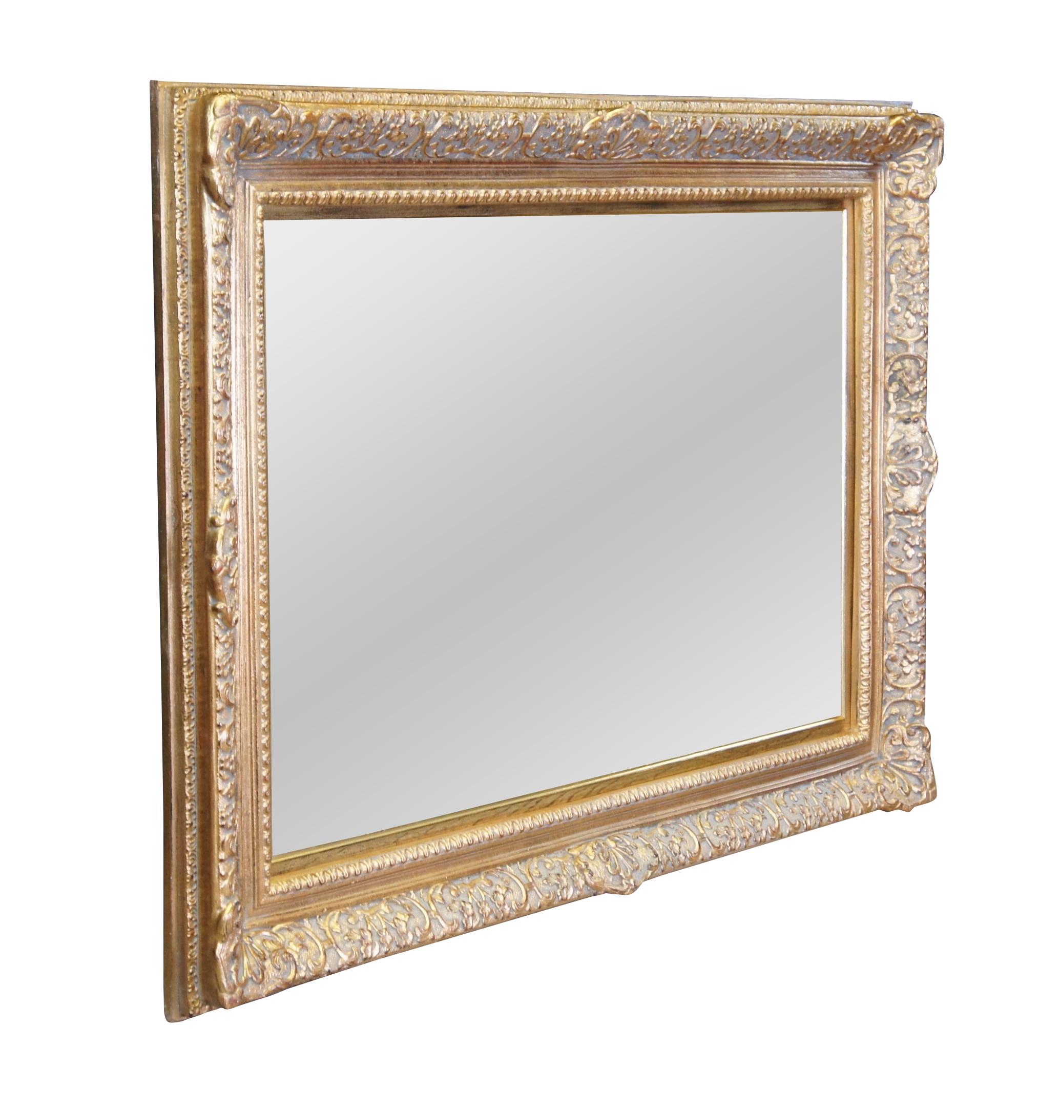 An Italian Baroque style mirror.  Features an ornate gold frame made from pine and beveled glass plate mirror.  Can be hung vertical or horizontal.  Great for over a console, bathroom, bedroom or above a mantel.  Would also work well as a painting /