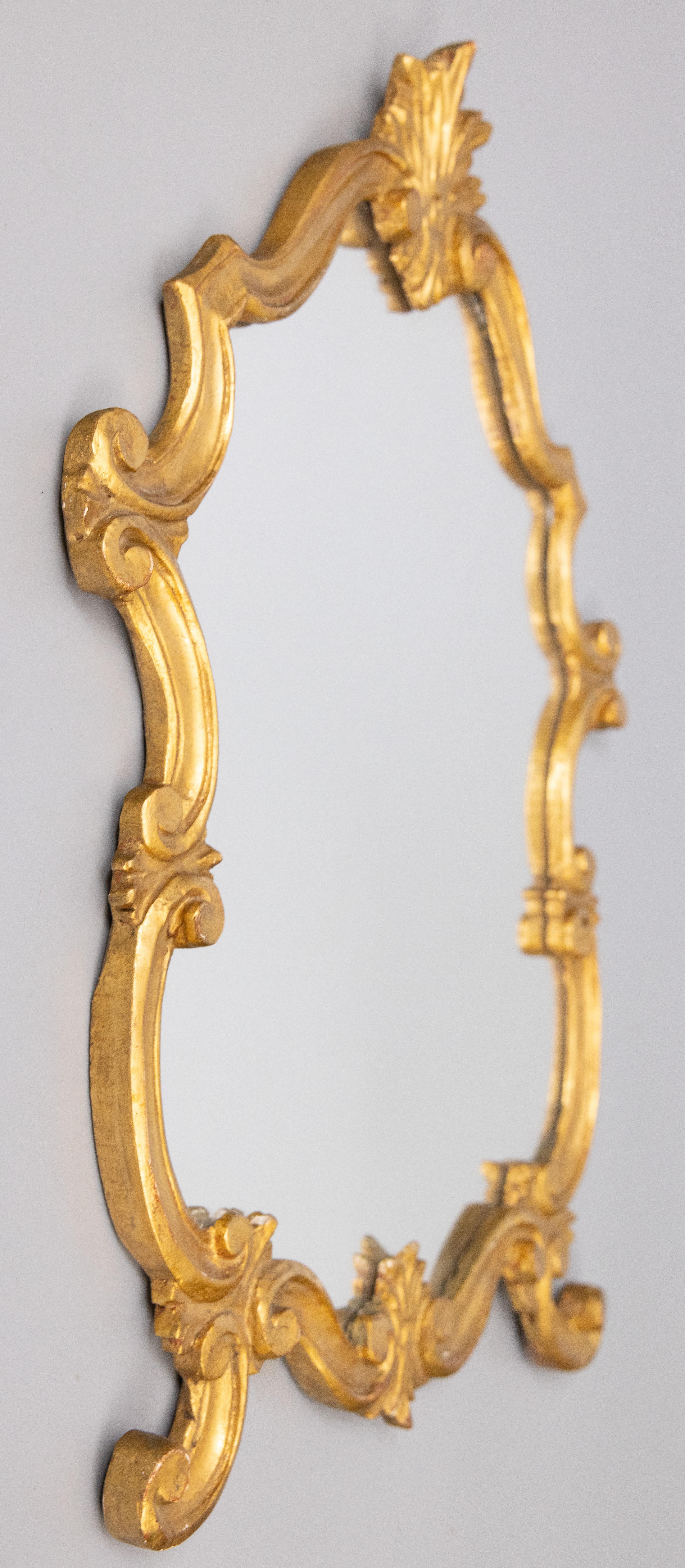 A stunning vintage small-scale Italian Baroque style gilt wood mirror, circa 1950. Marked 