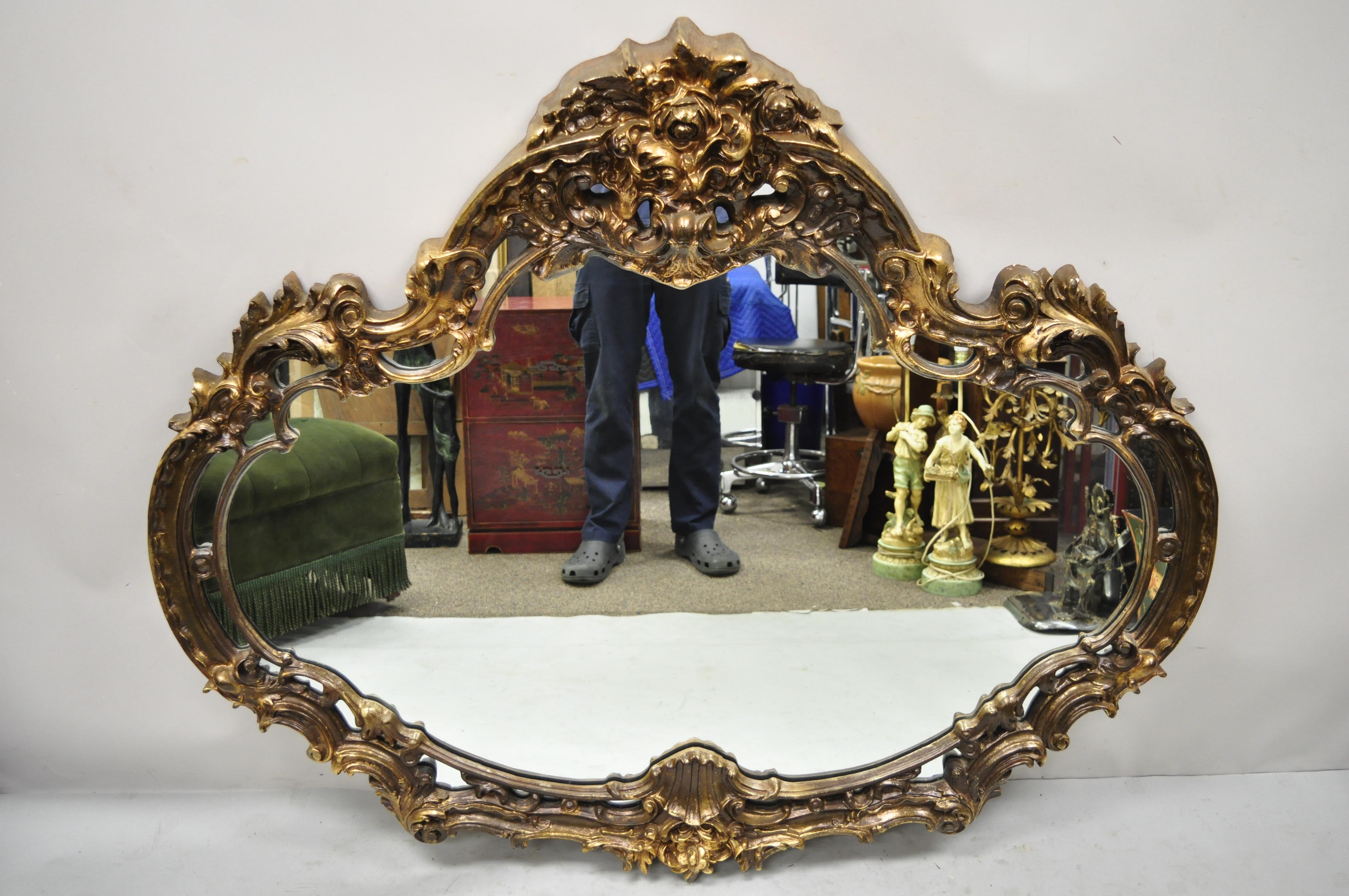 Vintage Italian Baroque style gold Hollywood Regency large sofa wall mirror. Item features molded foam ornate frame, large impressive size, distressed gold finish, great style and form. Circa 1970s. Measurements: 50