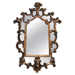 Miroir mural italien baroque vintage doré à la feuille décoré de têtes de fleurs