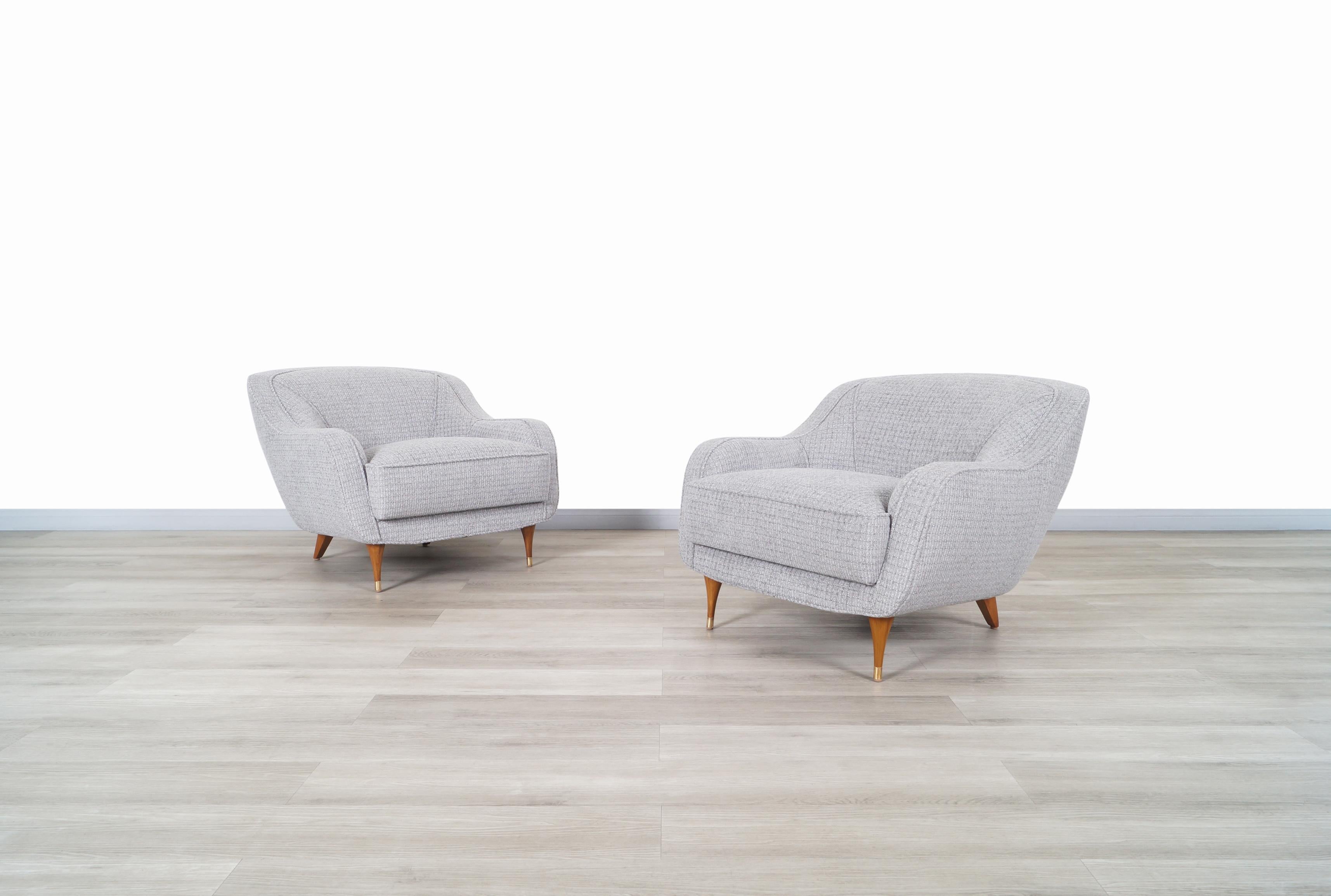 Exceptional vintage Italian “Barrel” lounge chairs designed and manufactured in Italy, circa 1950s. This pair of chairs stands out for its unusual style reflected in the circular shape design. Features comfortable cushions on the top that have been