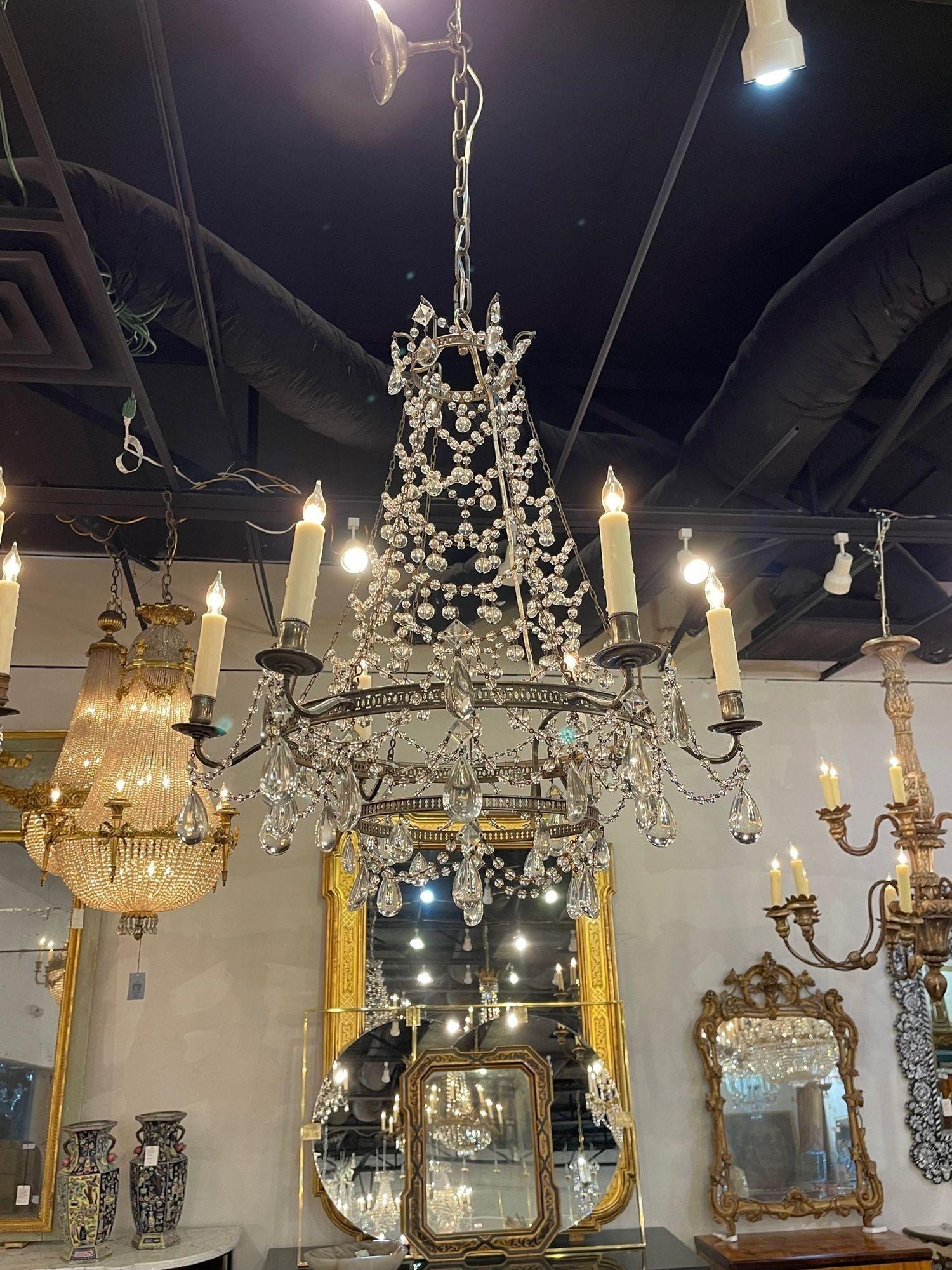 Beautiful vintage Italian beaded crystal chandelier with tear drops on a silvered base. A very nice fixture that is light and airy. Adds a touch of elegance!
