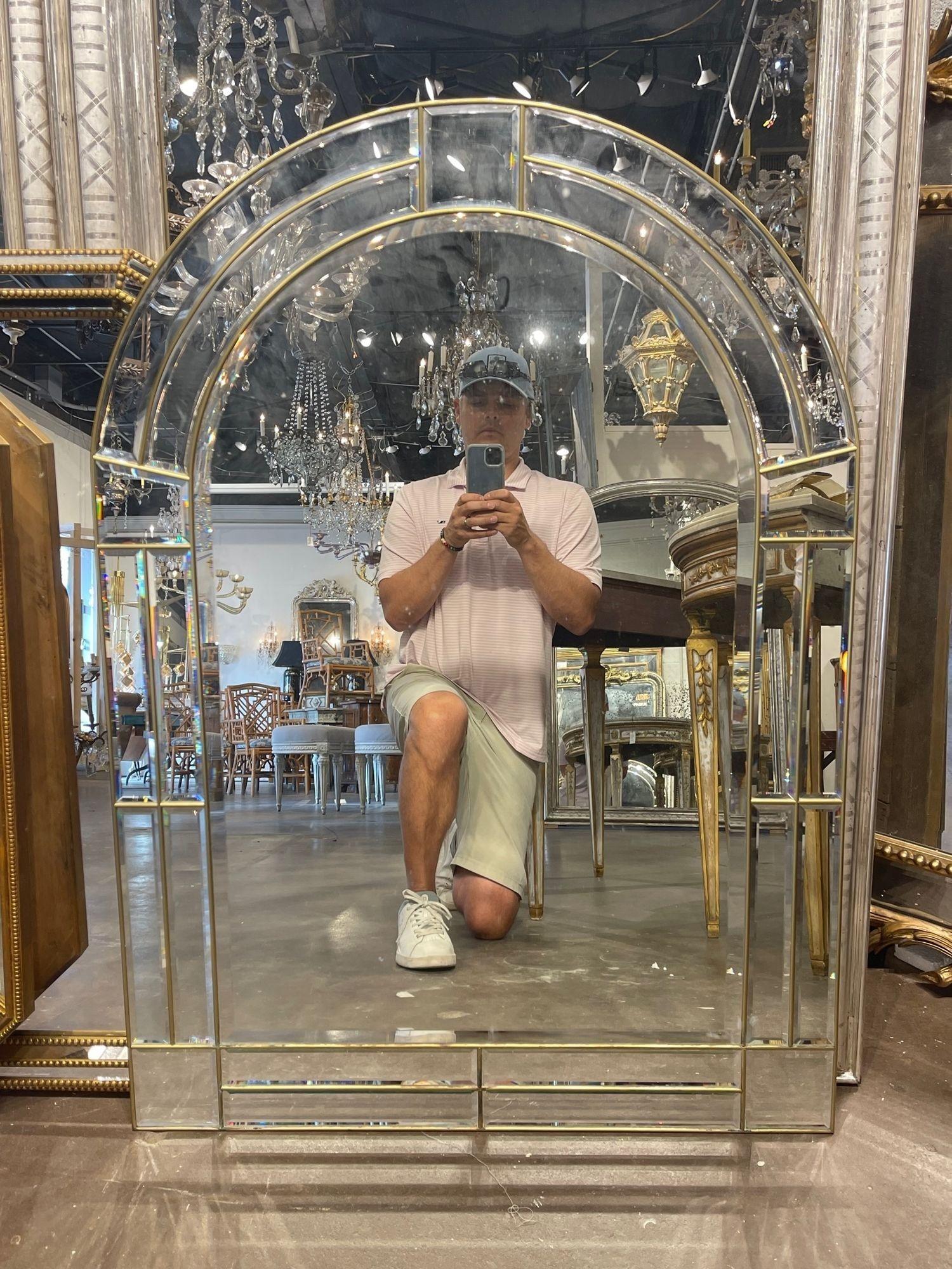 Lovely vintage Italian beveled glass and brass arch topped mirror. This fabulous mirror would be great for traditional or modern decor. Outstanding!