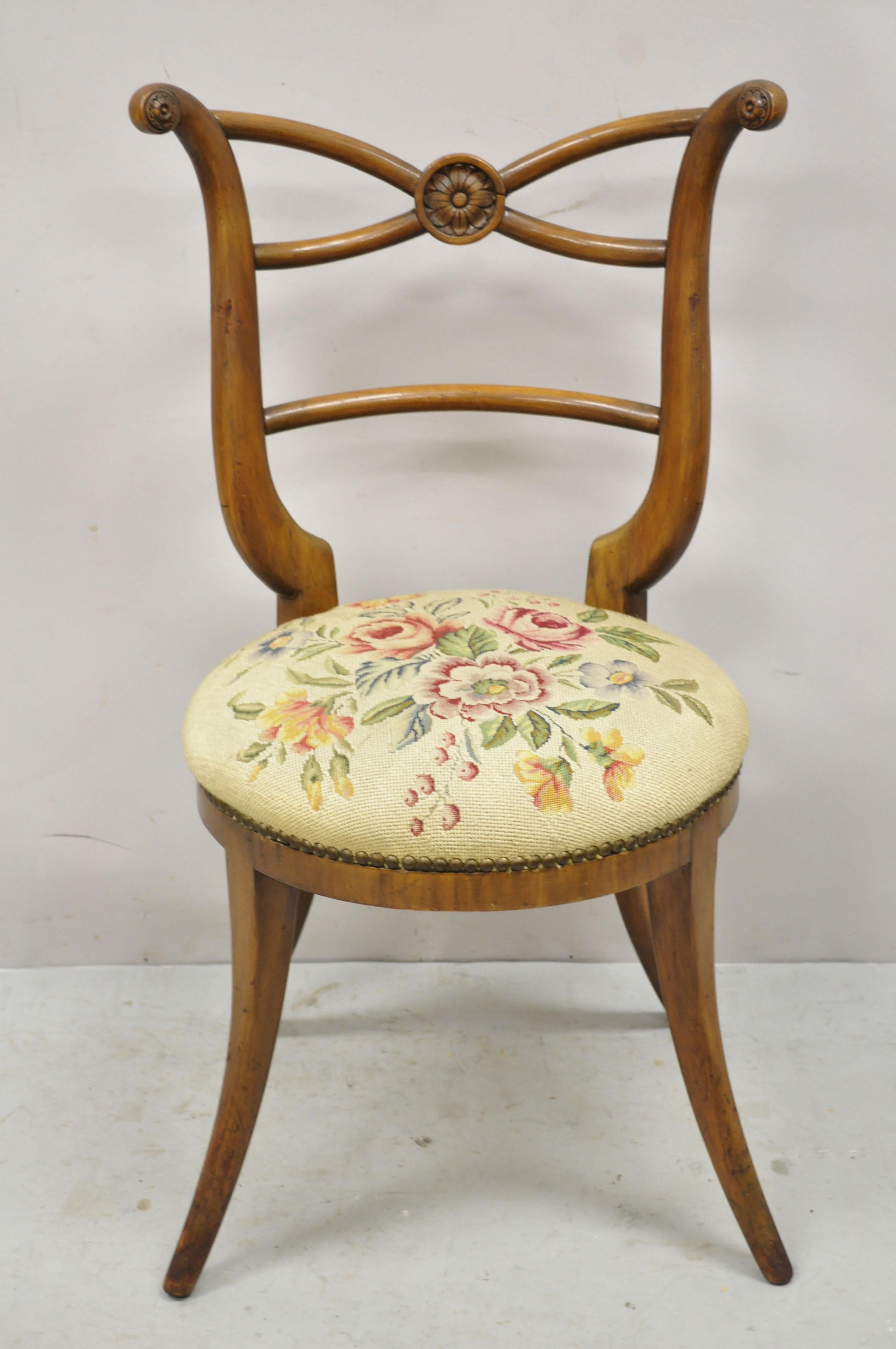 Vintage Italian Biedermeier Saber Leg Accent Side Chair with Needlepoint Seat. Item features needlepoint upholstered seat, solid wood frame, nicely carved details, shapely saber legs, great style and form. Circa Early to Mid 1900s. Measurements: 34