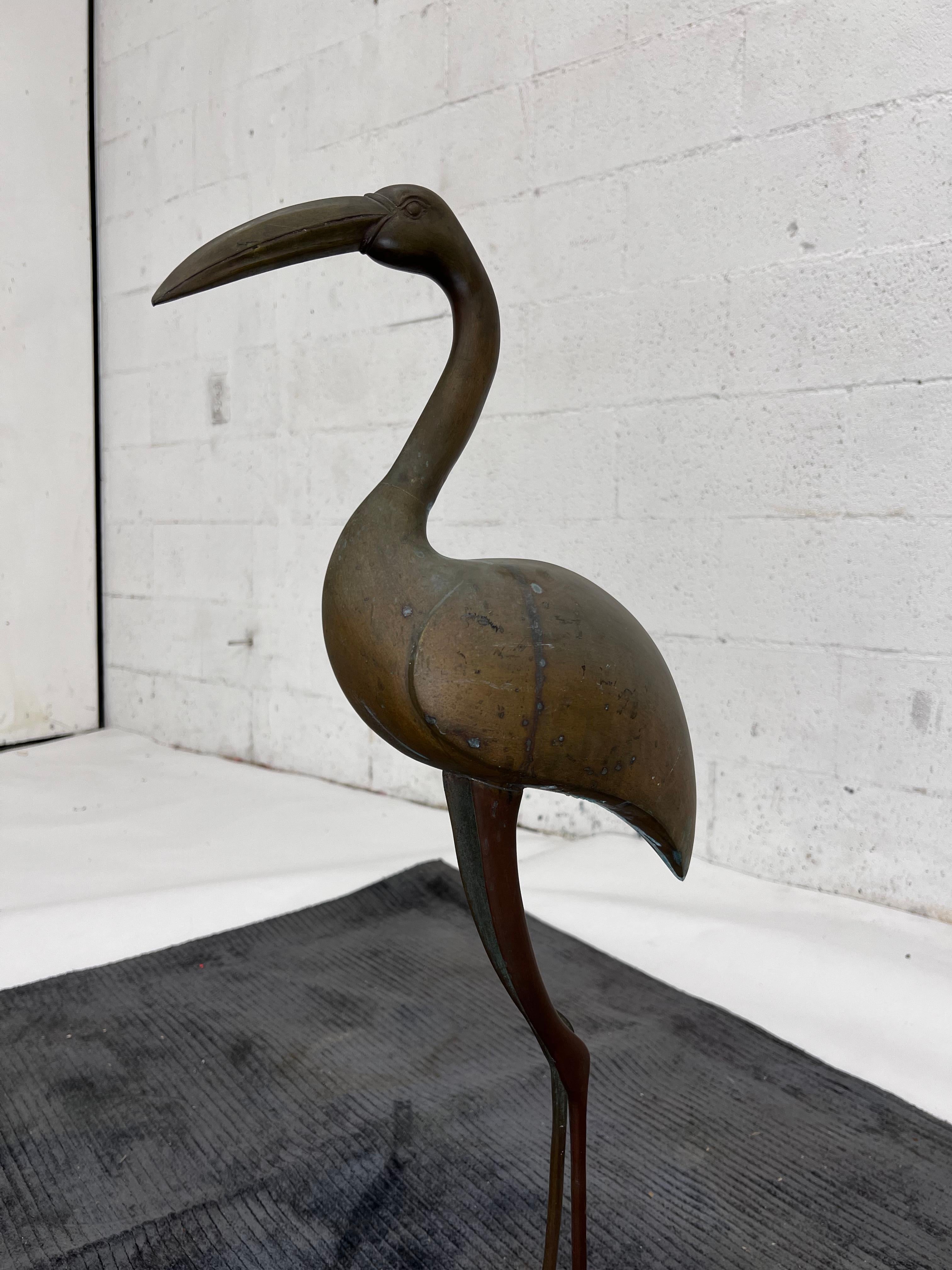1970s Heron or Crane. Full bronze construction, heavy and sturdy. Can be polished to bright finish or left with original patina. 

Measures: 29.75”H
7.75” base.