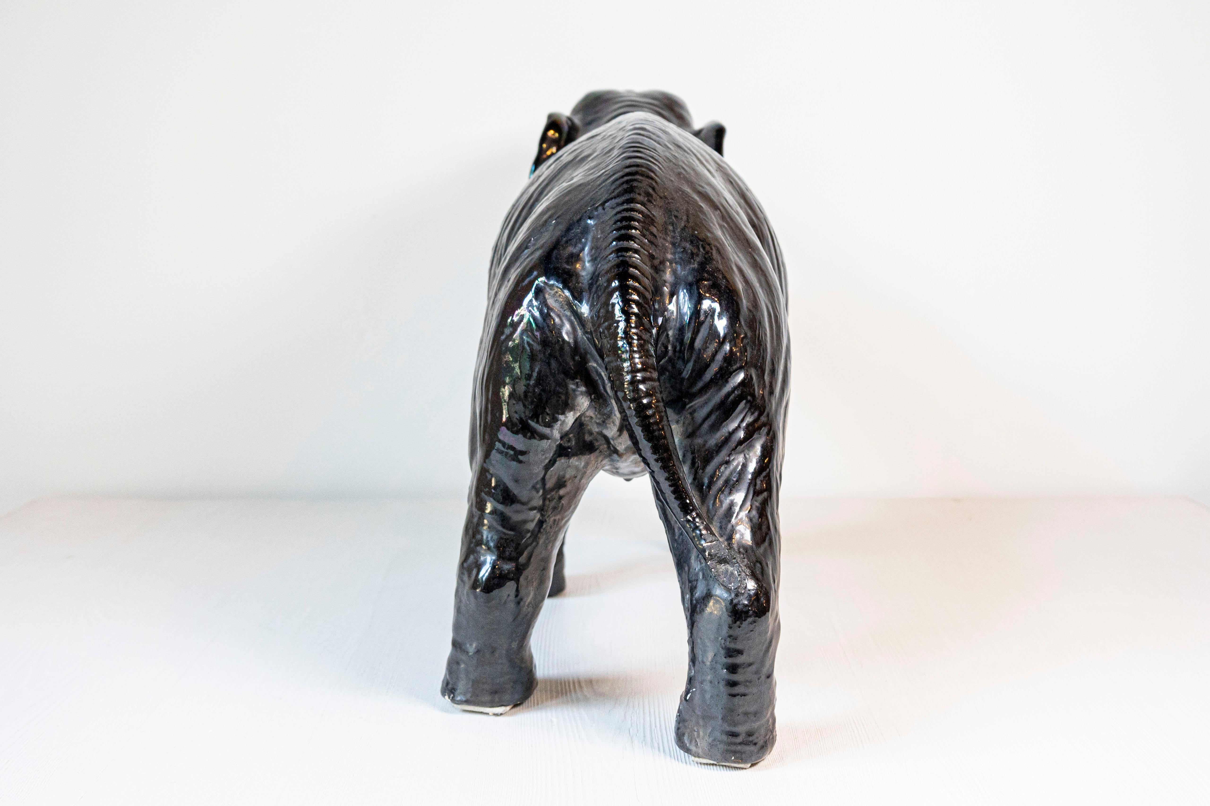 20th Century Vintage Italian Black Glazed Ceramic Sculpture of a Walking Elephant, Trunk Up For Sale