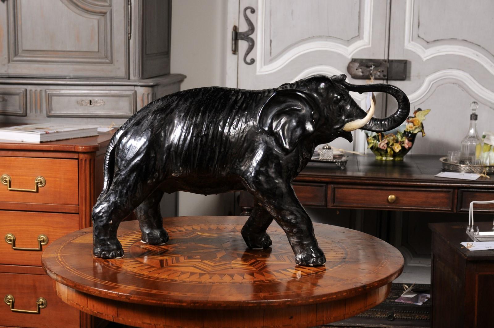 20th Century Vintage Italian Black Glazed Ceramic Sculpture of a Walking Elephant, Trunk Up For Sale