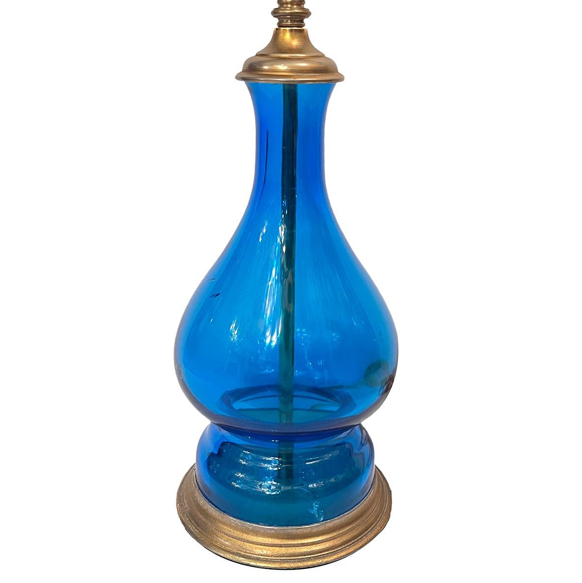 A circa 1950's Italian blown blue glass lamp with brass base.

Measurements:
Height of body: 13.25
