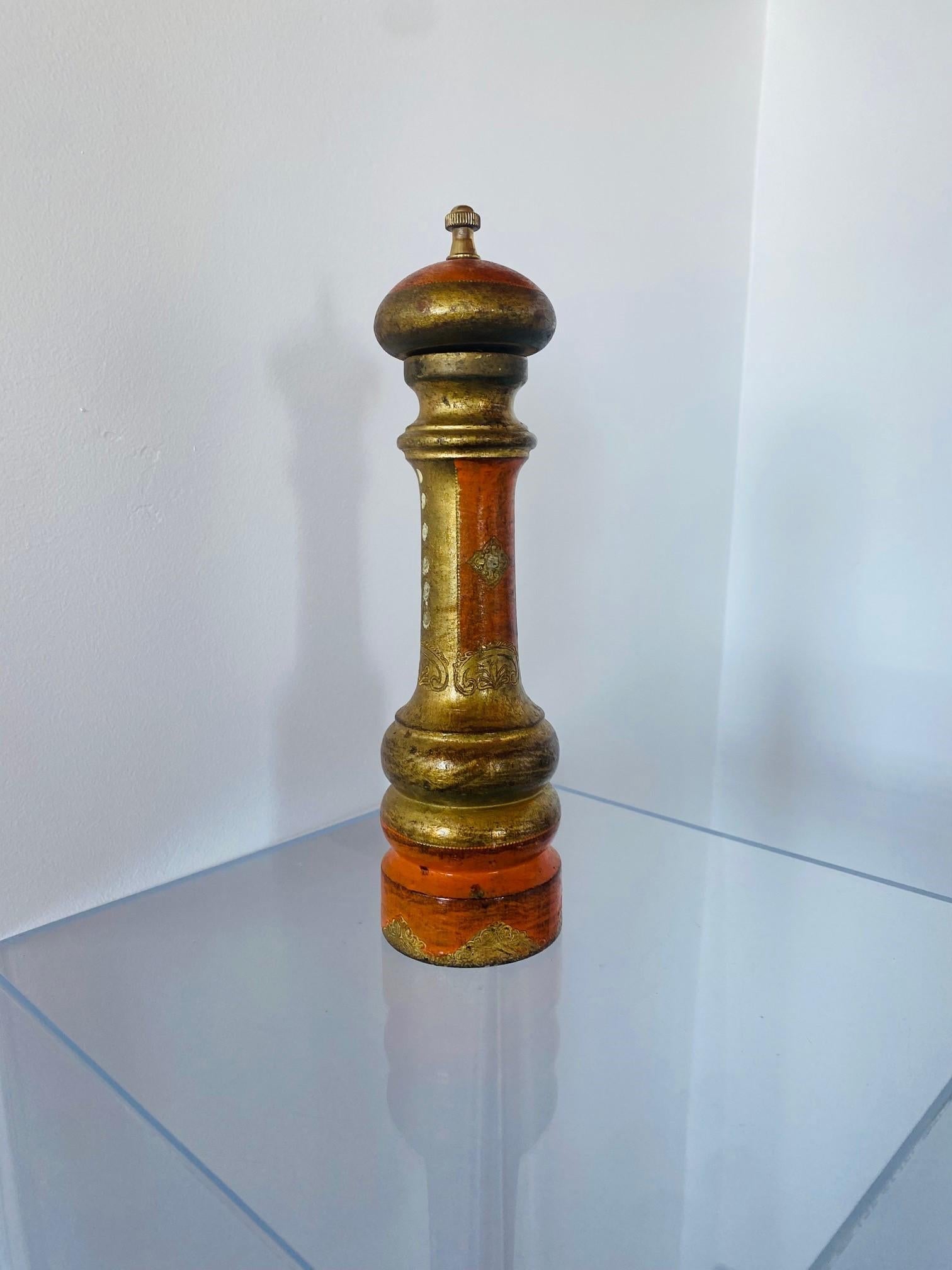 Beautiful piece from the 1970s made in Italy. This piece is vintage and sculptural. The design is unique, starting with a brass finial at the top and running down in sculpted curved lines in gilt and golden orange hues. This piece combines Borghese