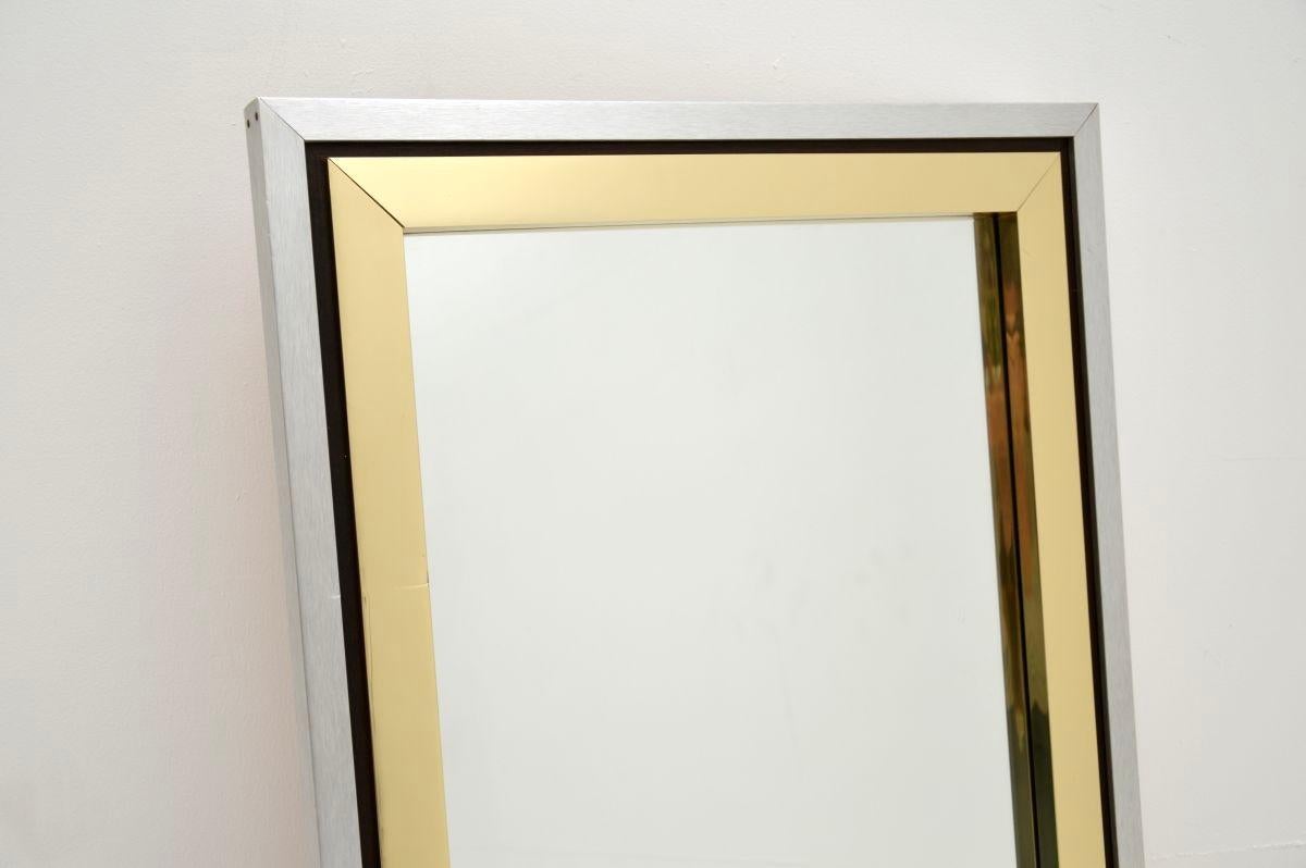 A stylish and very well made vintage Italian brass and brushed steel mirror, dating from around the 1970’s. It has a label on the back which says Studio Design, this was likely the UK retailer.

It is of lovely quality and is a great size. The outer