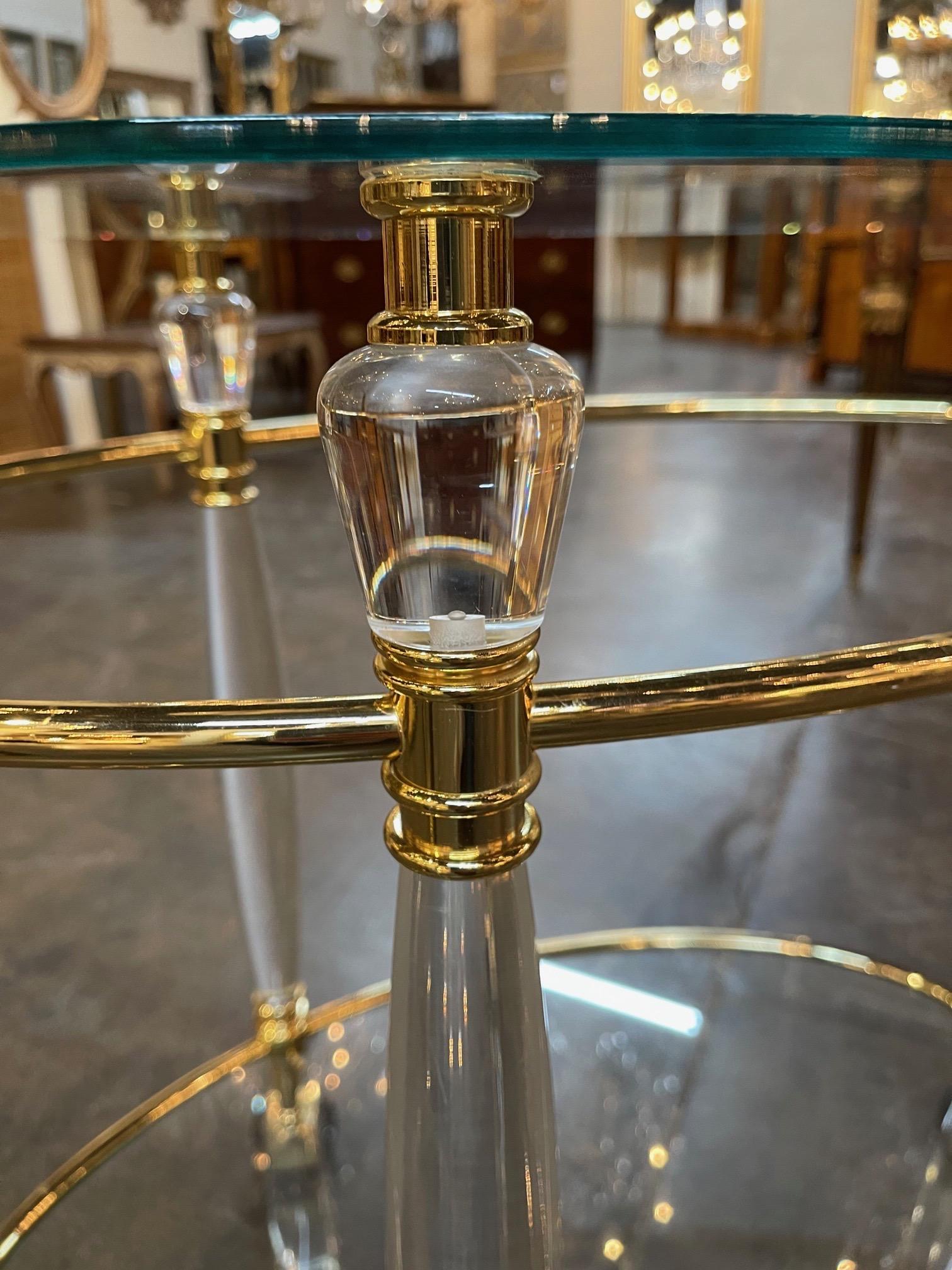 Glamorous vintage Italian brass and Lucite bar cart on wheels. Creates a polished look!