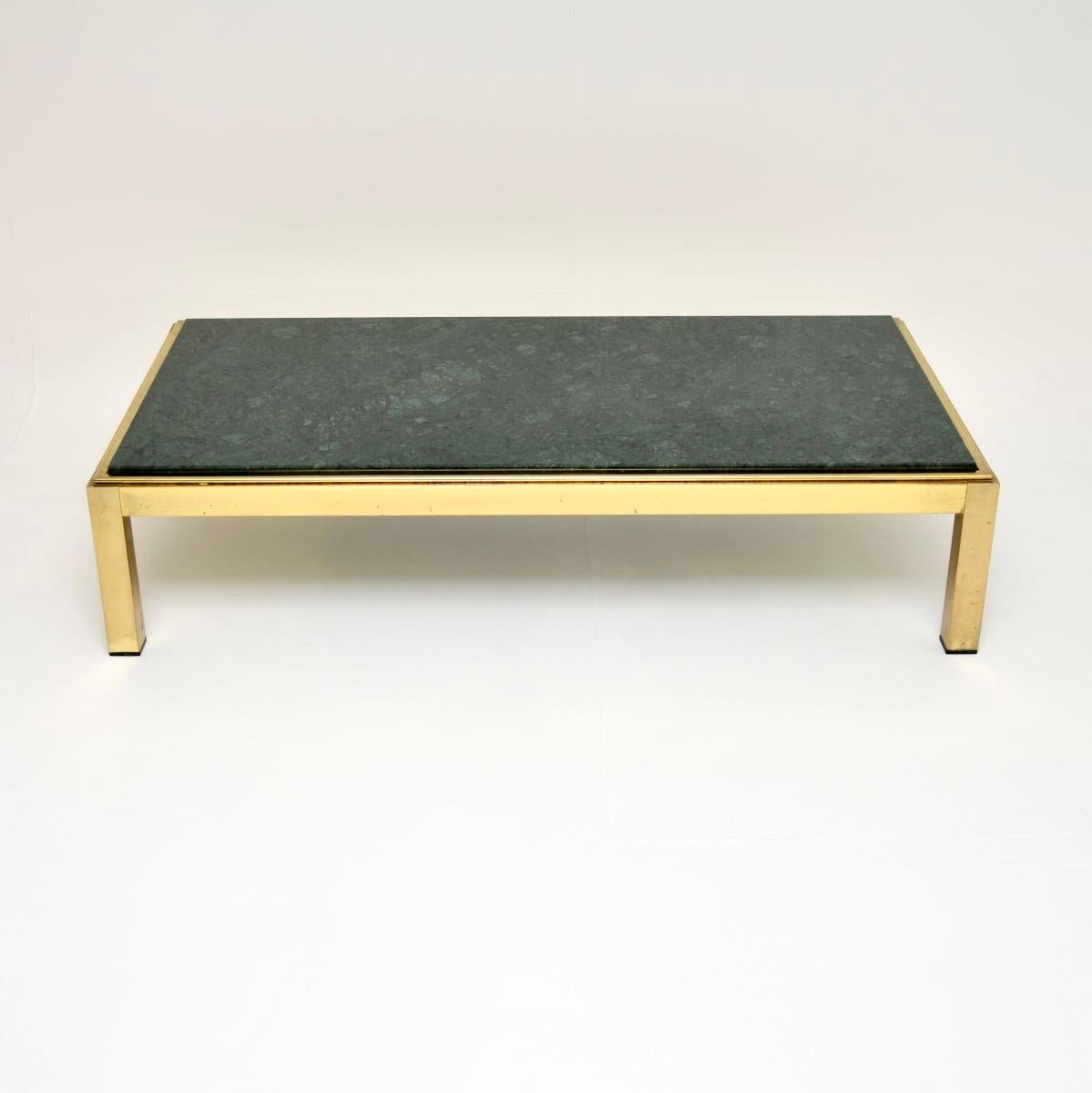 A stunning vintage Italian brass and marble coffee table, dating from the 1970’s.

This is very large and impressive, the quality is outstanding. The frame is brass plated most likely on steel, it is very sturdy with a lovely design. It has a