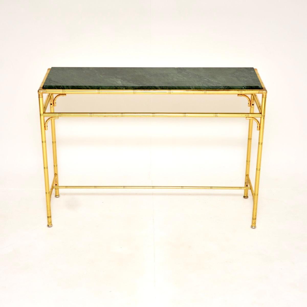 A fantastic vintage Italian brass and marble console table, dating from the 1970’s.

It is of great quality with a very stylish, faux bamboo design. The brass frame is nicely finished on both sides, so this can be used as a free standing item. We