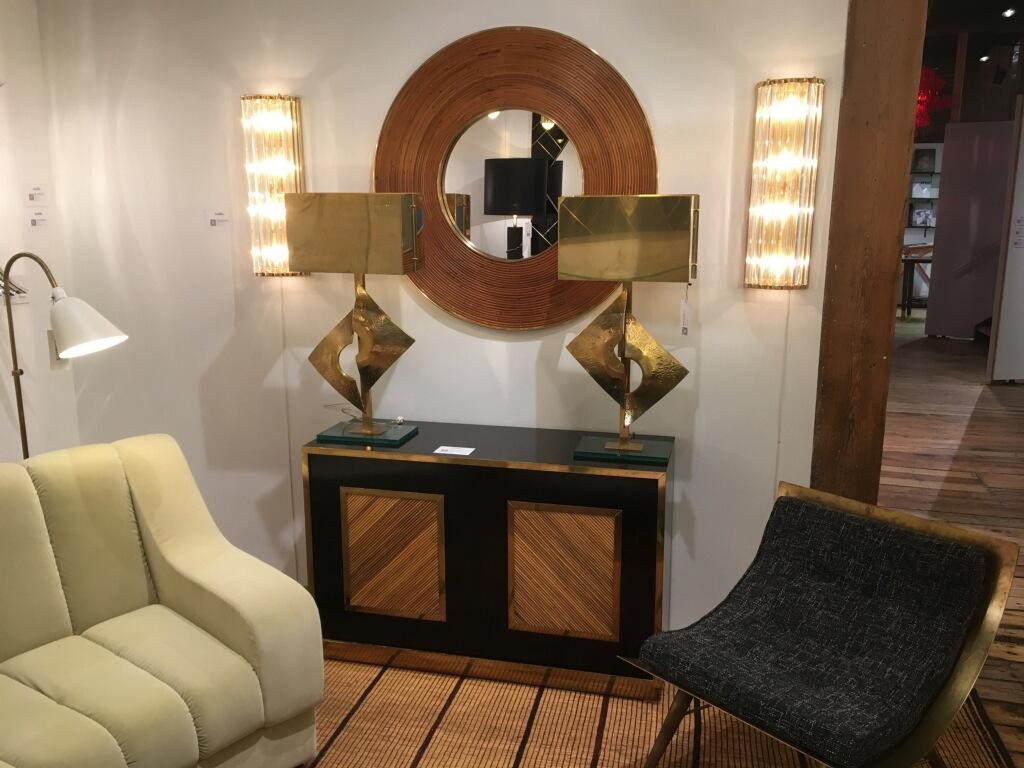 Original Italian Mid-Century Modern sideboard or credenza in bamboo, brass and black laminate. Black front doors are edged with brass inlays and a center panel in bamboo. Brass plynth. Single shelf inside.
 