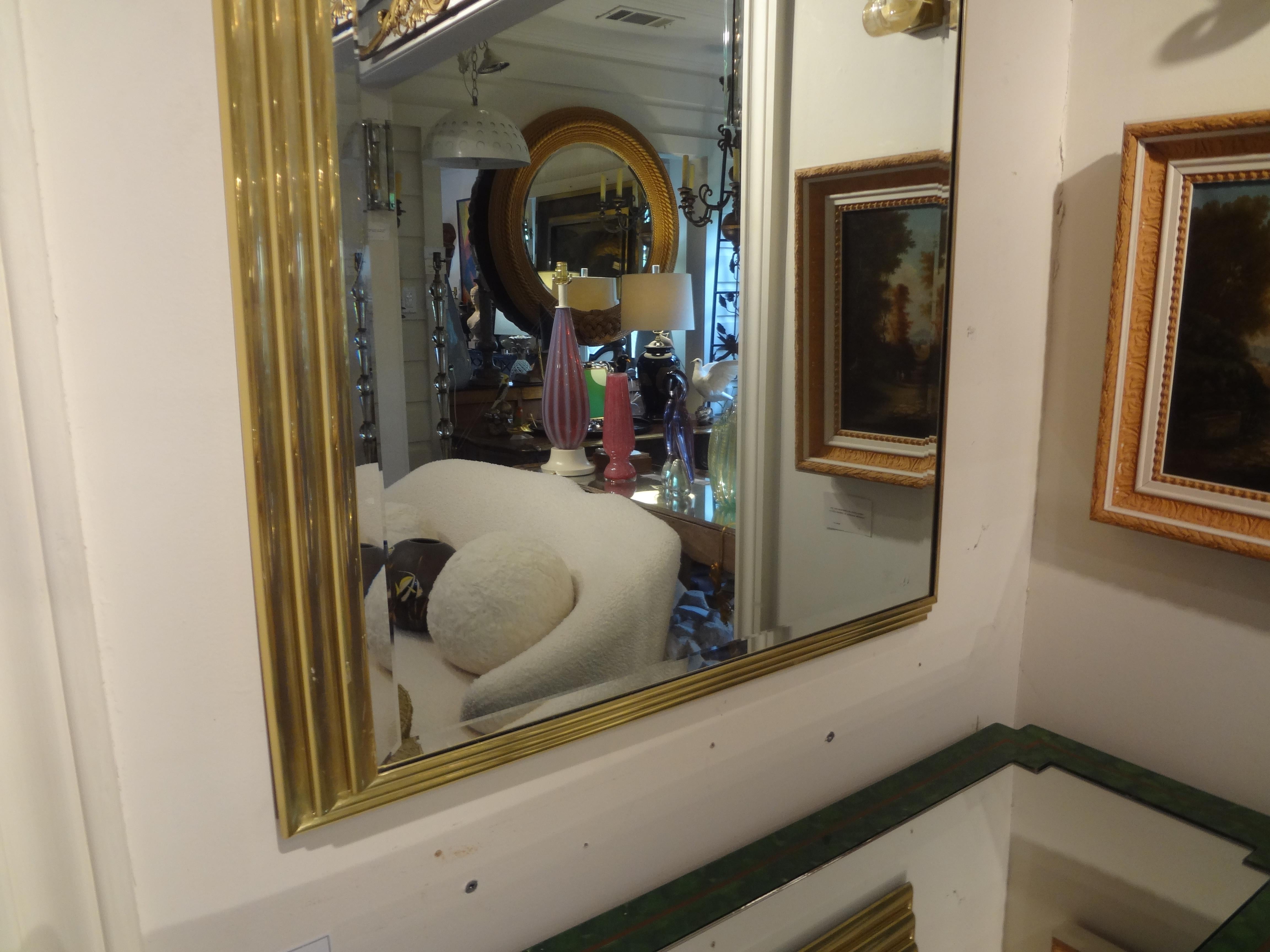 Great mid-century Italian rectangular stepped brass beveled mirror. This versatile brass mirror can be displayed either vertically or horizontally.