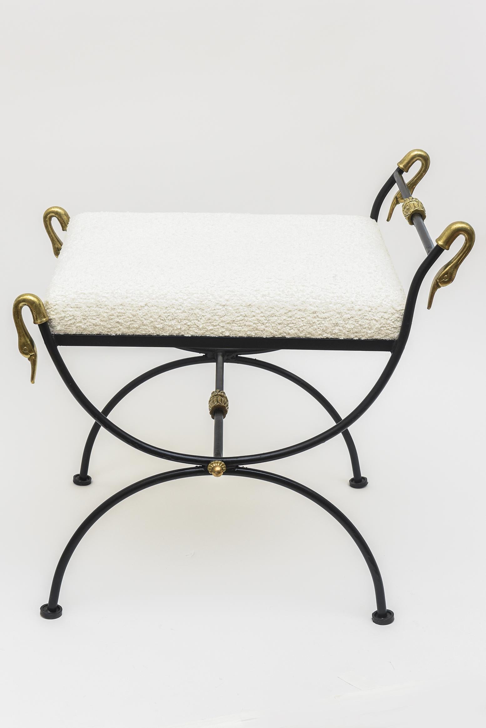 This fully restored vintage Italian swan bench is black painted iron, brass, wood and new upholstery of white boucle. It is from the 60's. It has all been redone from top to bottom and all the brass was polished. There are 2 different heights of the
