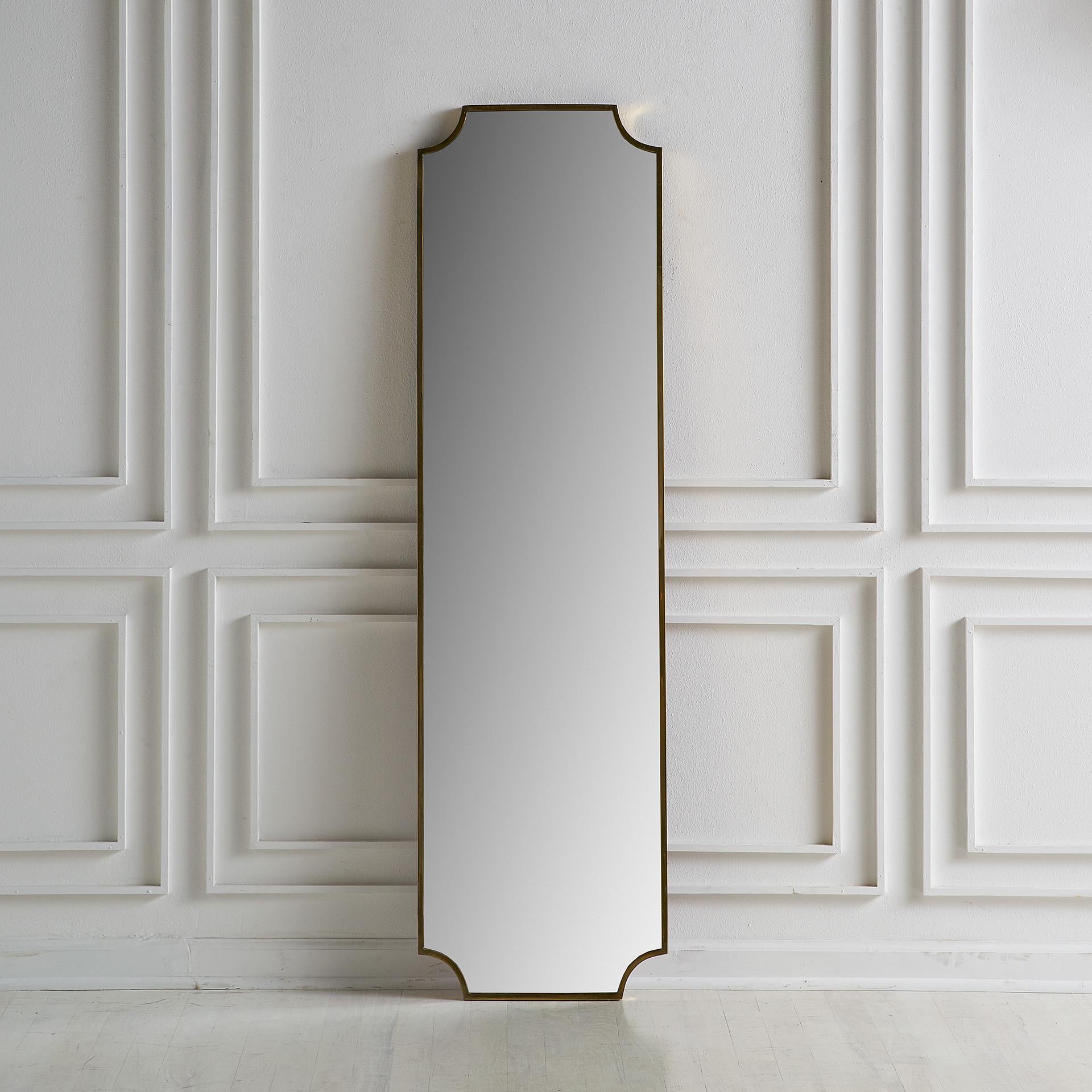 We’re always on the lookout for versatile mirror. This mirror was sourced in Europe and features a beautiful scalloped shape brass frame. Finished with a wooden back. Ready to hang.

Dimensions: 57” H x 16” W x 1” D

Condition: Slight areas of