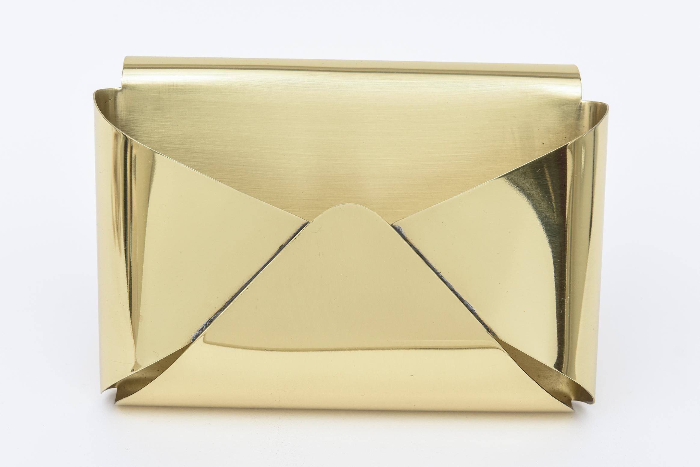This ever so chic and obscure vintage Italian brass box is simply a pop art design of a form of an opened up envelope that is a box. it is from the late 60's or early 70's. It has been meticulously polished and then lacquered so it will not patina.