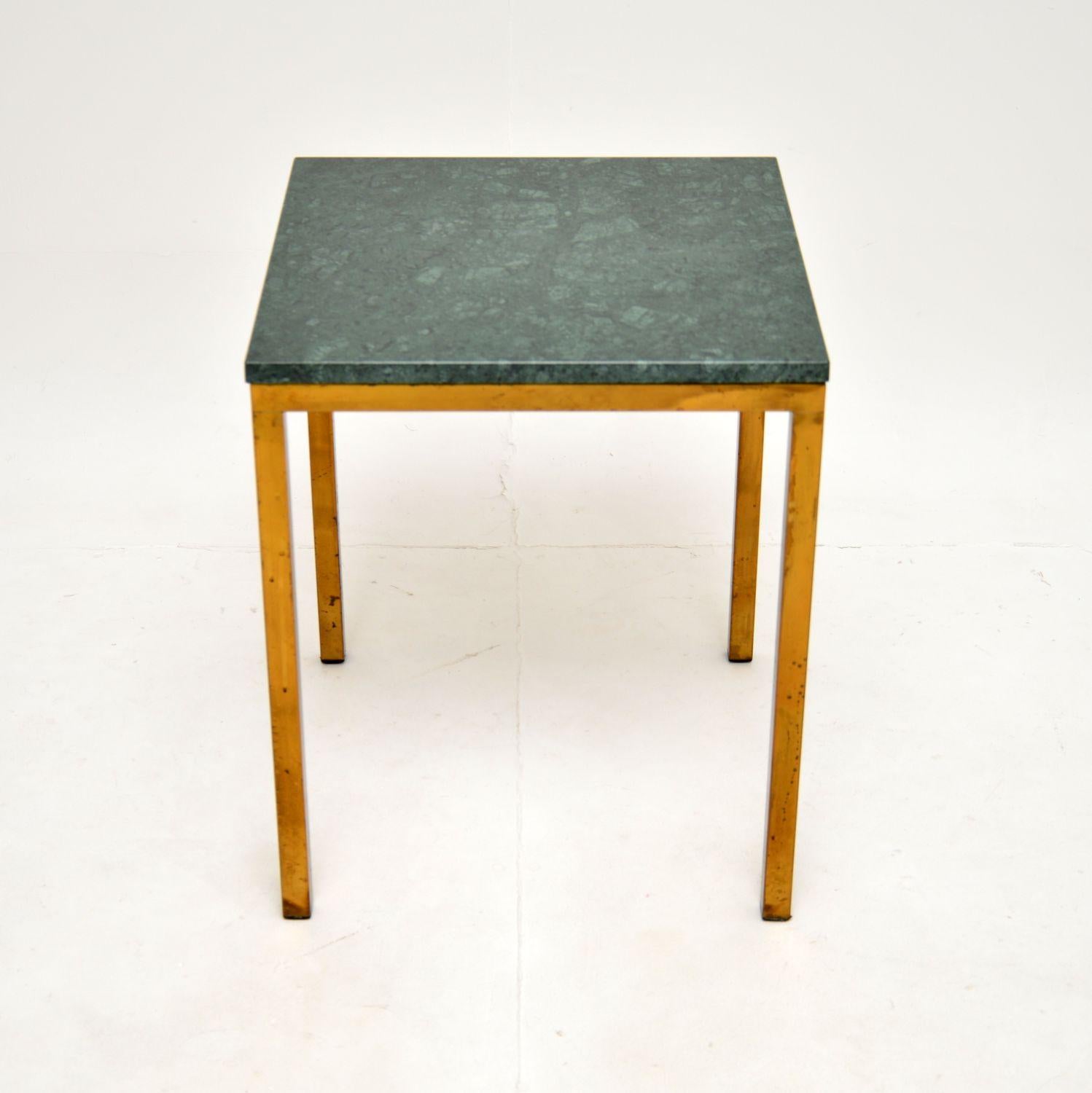 A stylish and very well made vintage Italian brass & marble side table. This was made in Italy, it dates from around the 1970’s.

The frame is of super quality, it is solid brass and has acquired a lovely patina over the years. The green marble top