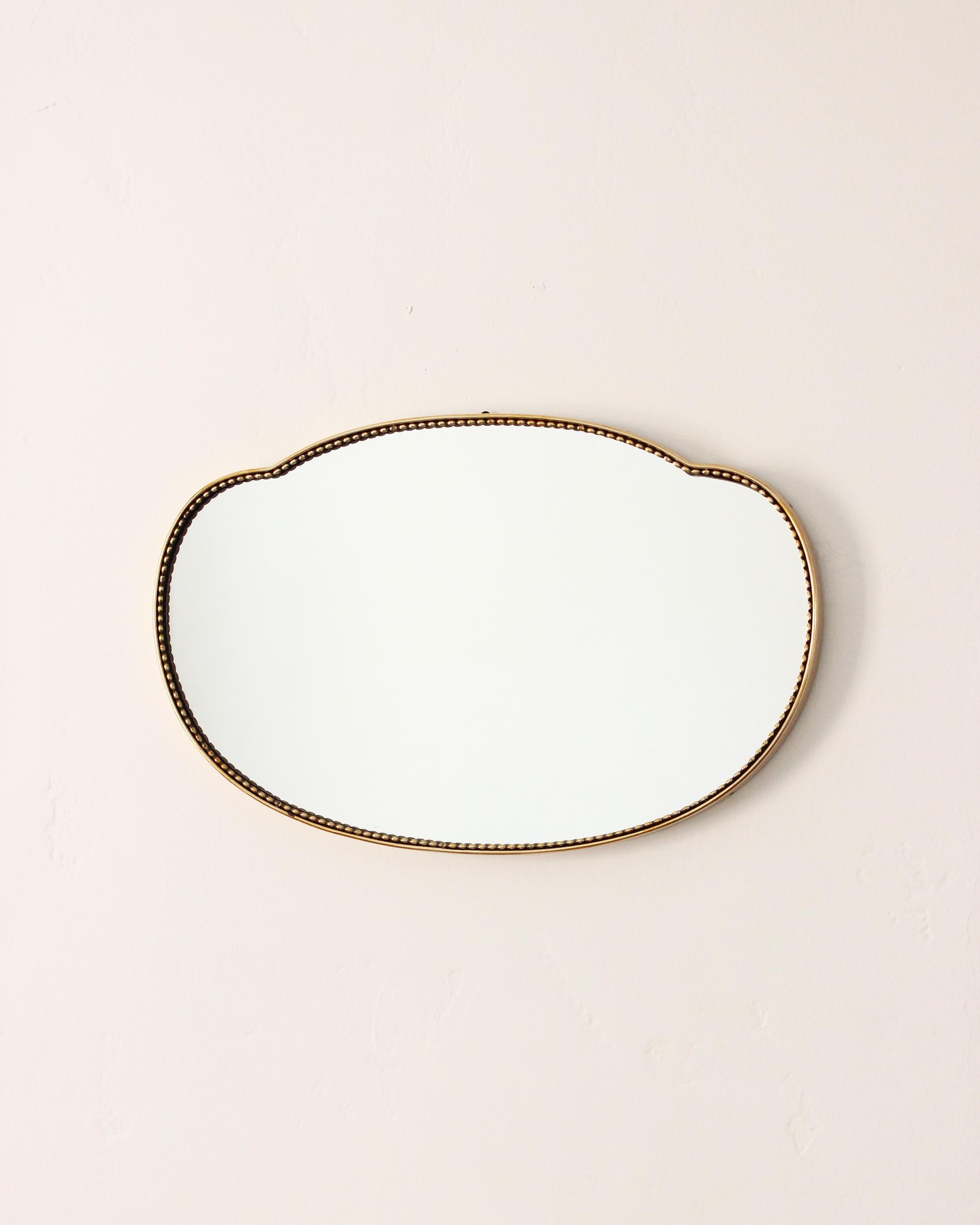 Organic wall mirror in the bean shape, produced in Italy, 1950s. Organically cut mirror glass is framed brass.

Other designers of the period include Gio Ponti, Fontana Arte, Max Ingrand, Franco Albini, and Josef Frank.
