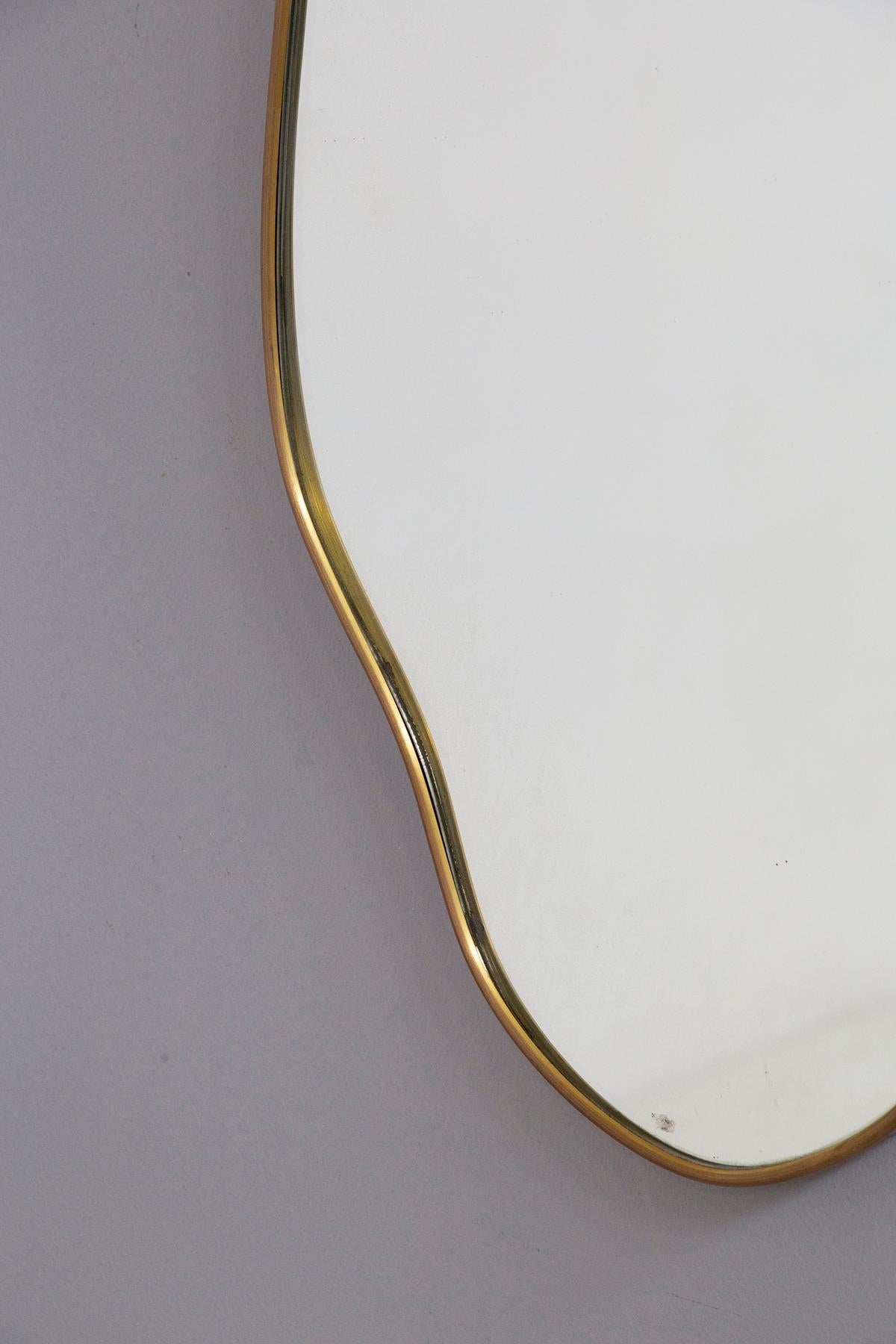 Mid-Century Modern Vintage Italian brass mirror with fluid shapes For Sale