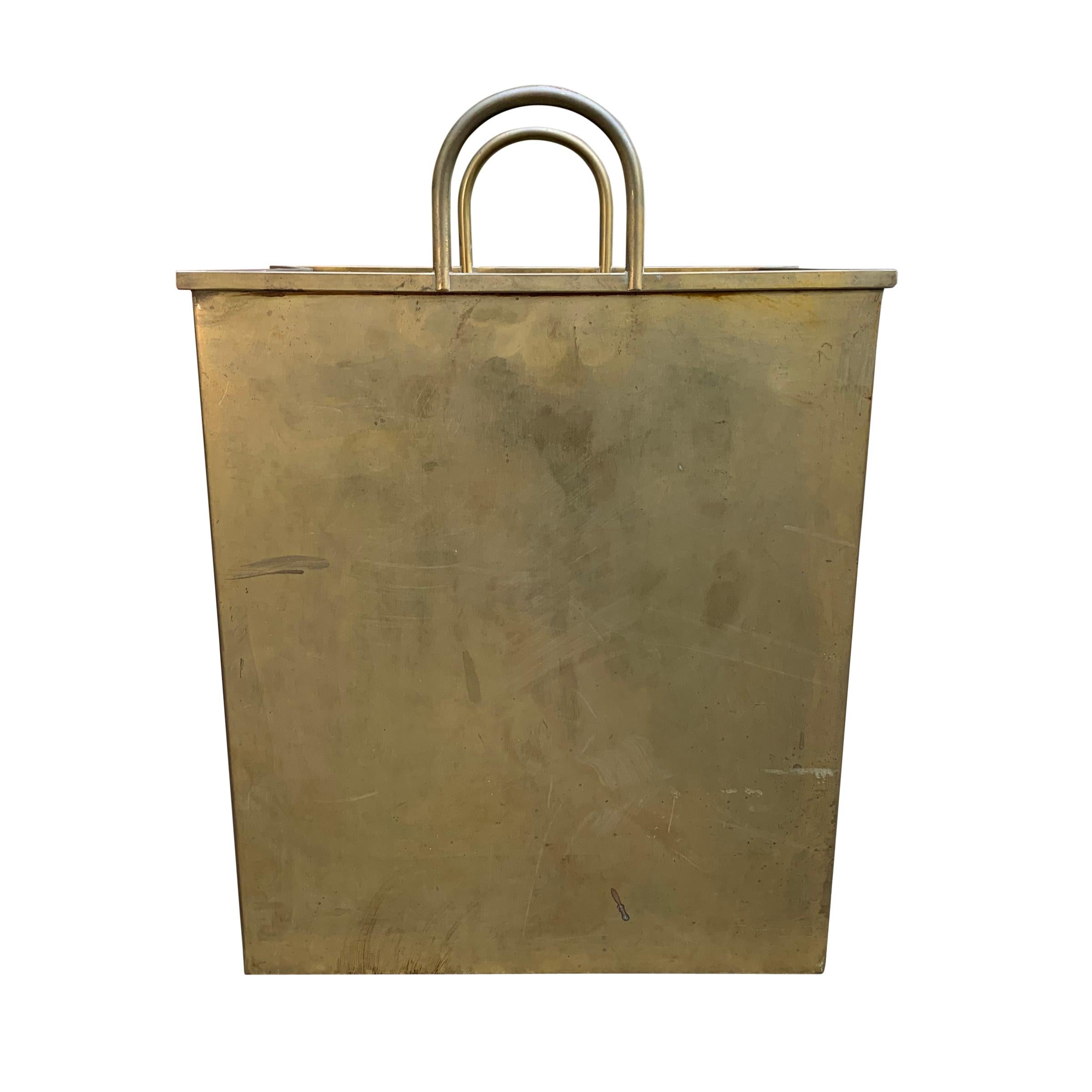 A whimsical vintage Italian brass wastepaper basket in the form of a folded shopping bag with two handles. The perfect pop-art accessory for your office or home!