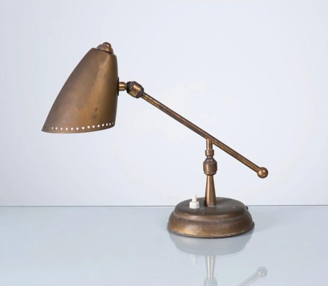Table lamp by Stilnovo

circa 1948, Italy 

Gorgeous patina to brass in original condition. Re-wired with a black silk cord to US standards. 

Approx 11.5