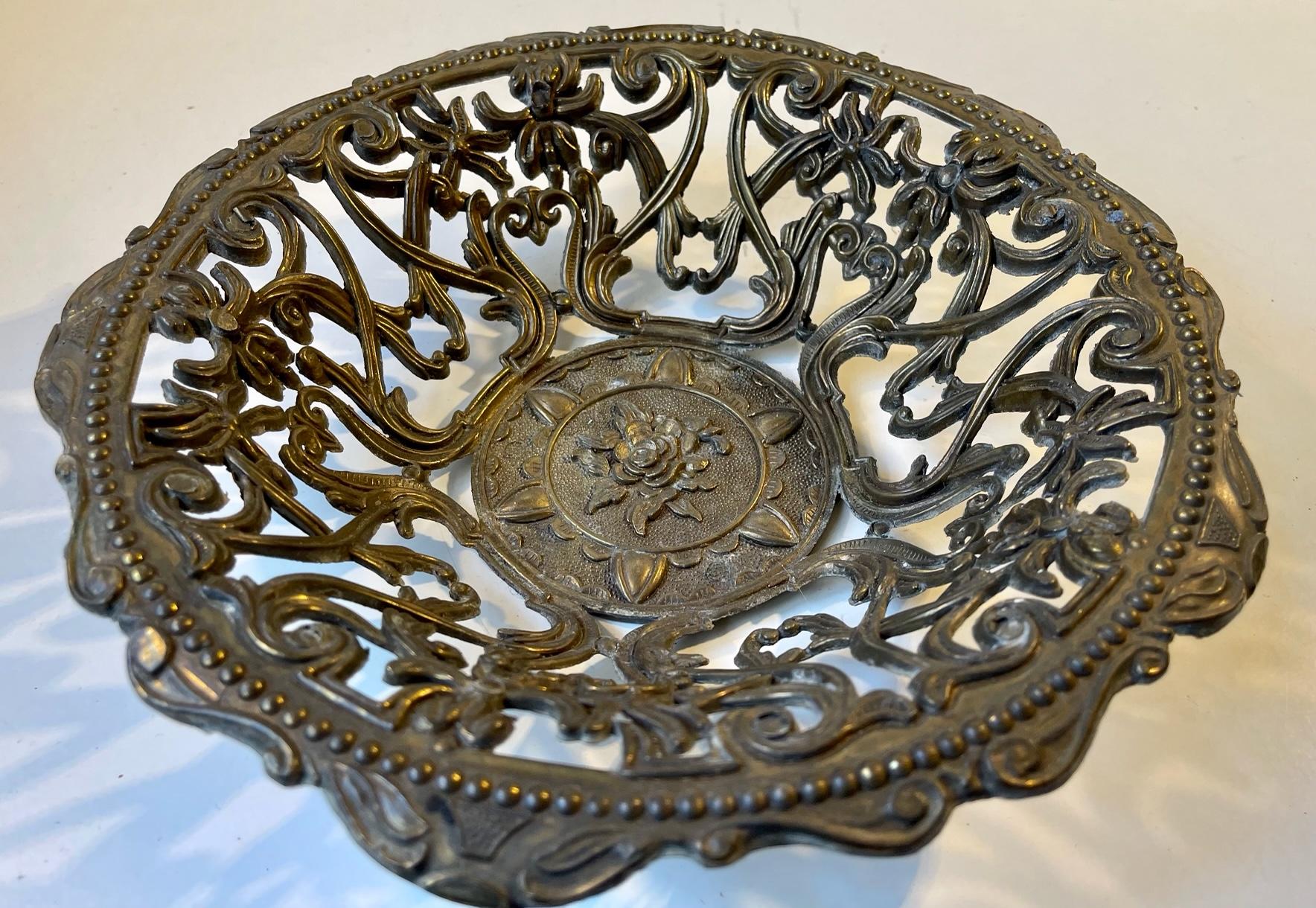 An Italian openwork/filigree/pierced basket or bowl for fruit bread or decorative purposes. Its made from solid cast brass that has patinated beautifully over the years. It was made in Italy circa 1970-80 after classical inspired ideals. Imprinted