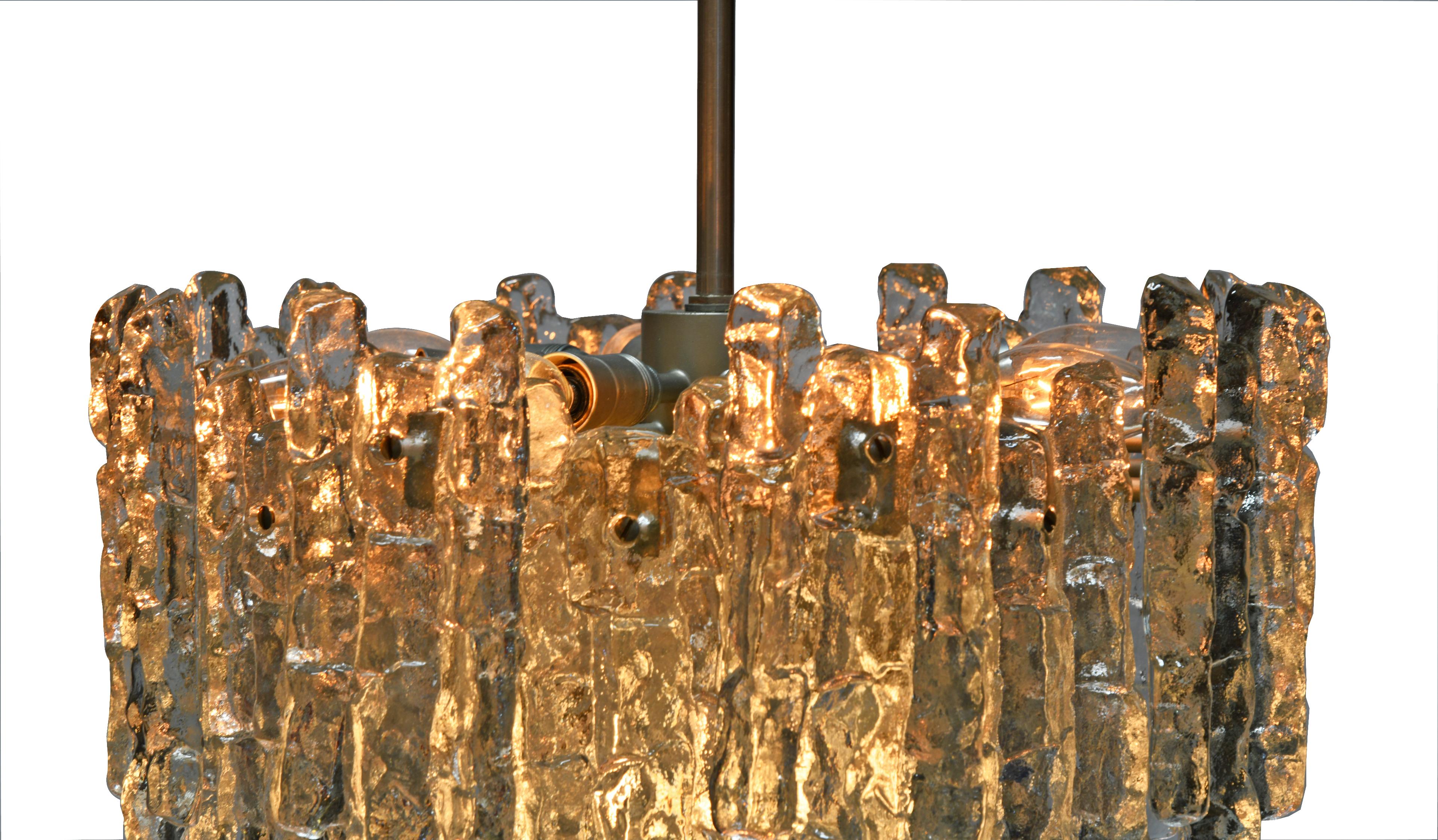 Brutalist cast glass with textured panels and a solid brass frame add depth and character to any room! 

Thomas Cooper Studio represents a multilayered, multifaceted collaboration, where materials and techniques join forces in a search for the inner