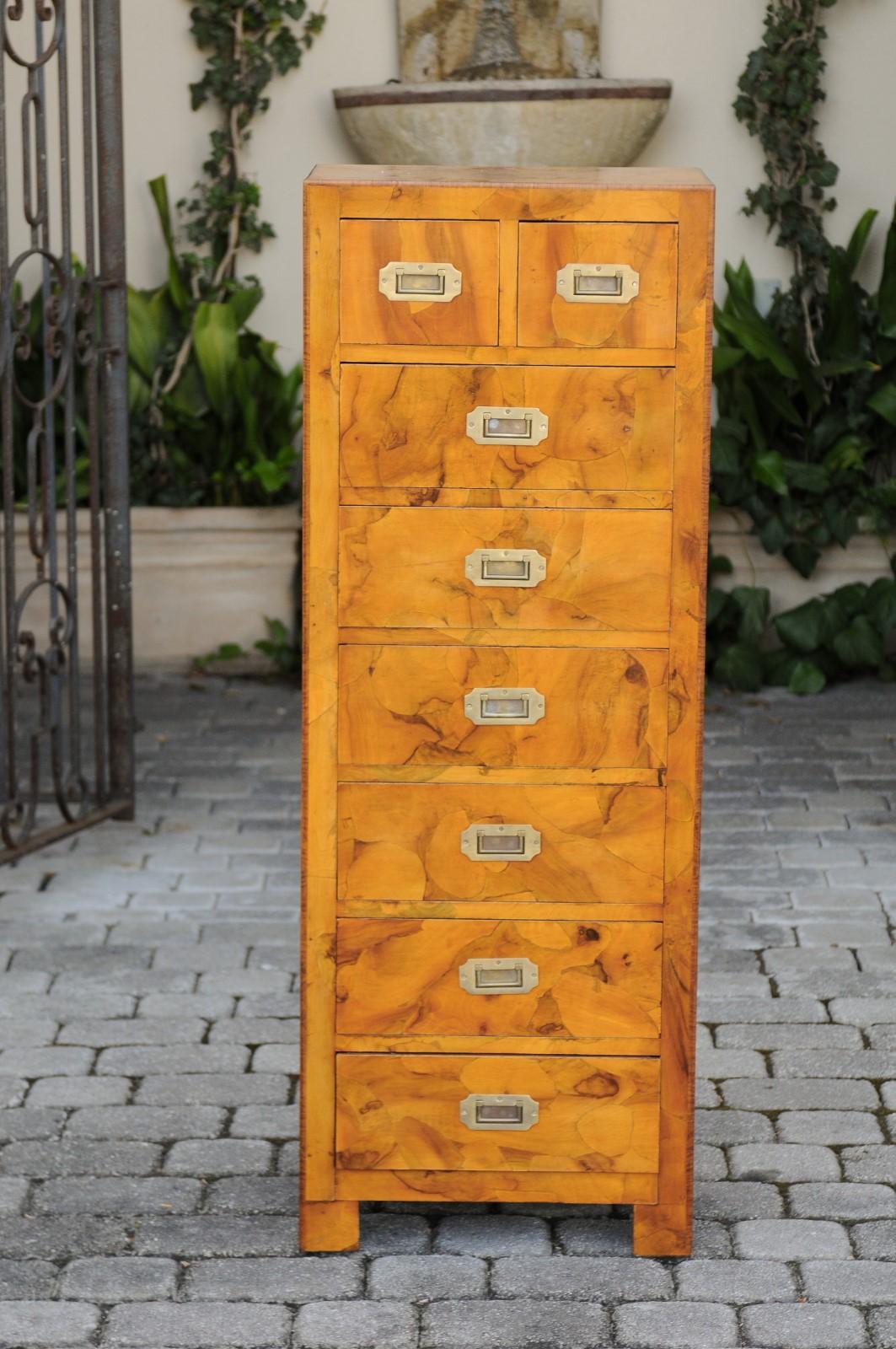 An Italian vintage burl wood Campaign style tall chest from the mid-20th century, with eight drawers and brass hardware. Born in France during the midcentury period, this elegant Campaign chest features a stunning burl veneered structure marked in