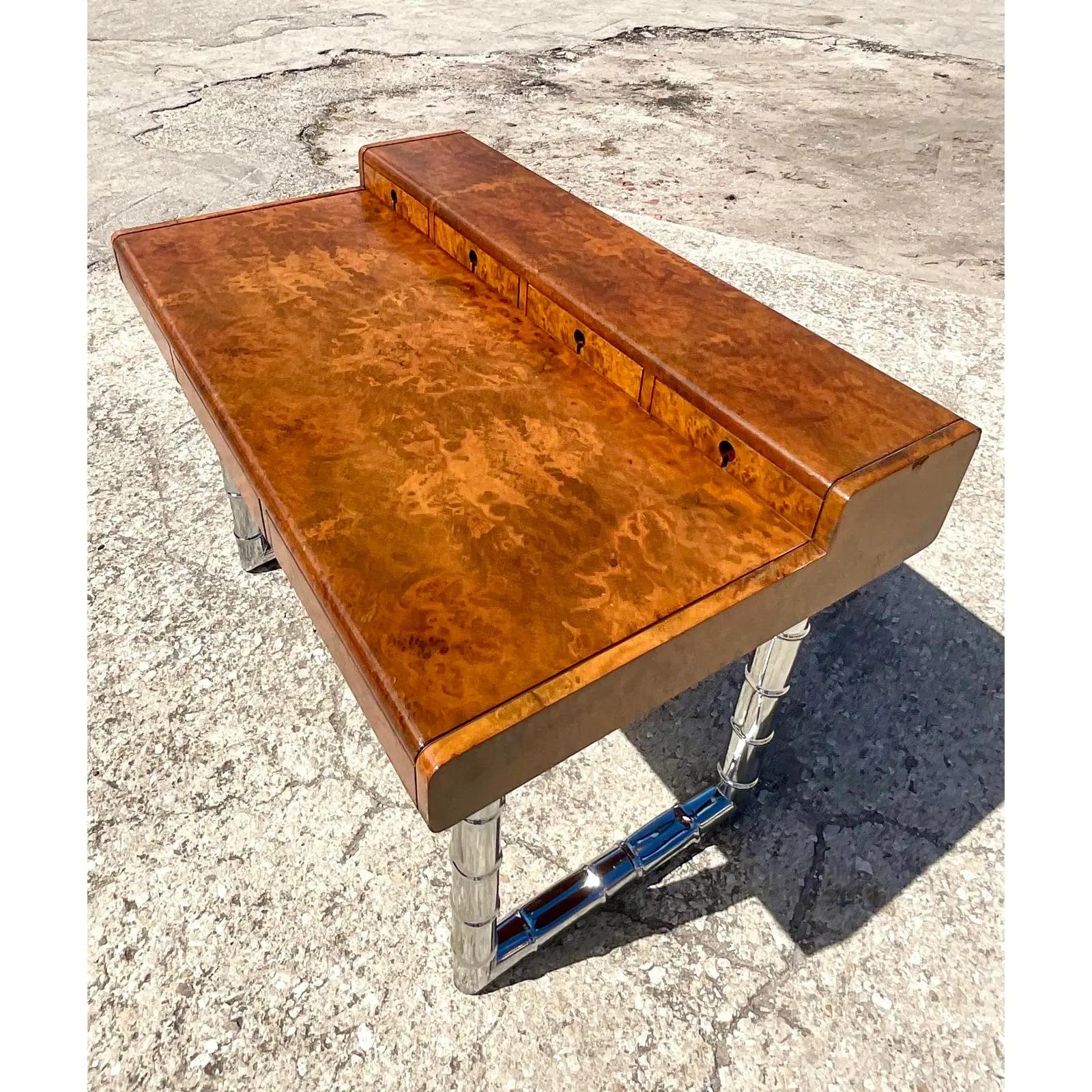 An exceptional vintage Burl wood desk. Gorgeous Italian design with numbered drawers and inset drawer pulls. Chic chrome bamboo legs. A real showstopper. Acquired from a Palm Beach estate.