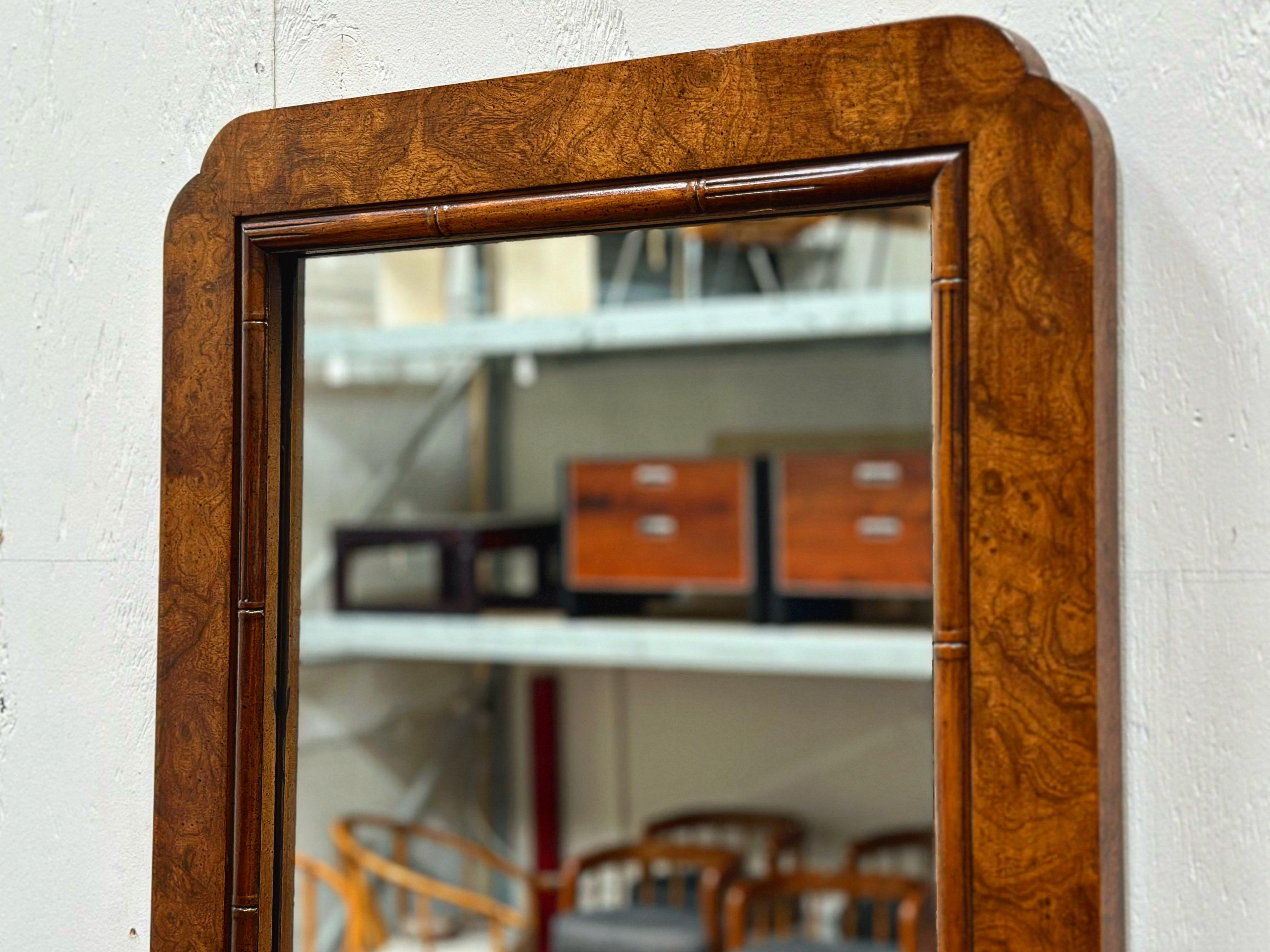 Gorgeous vintage midcentury burled olive wood mirror, Italy circa 1960s. Scalloped corner detail softens the overall look and adds sophistication.
Overall excellent condition with no flaws of note. The olive wood has been cleaned and conditioned and