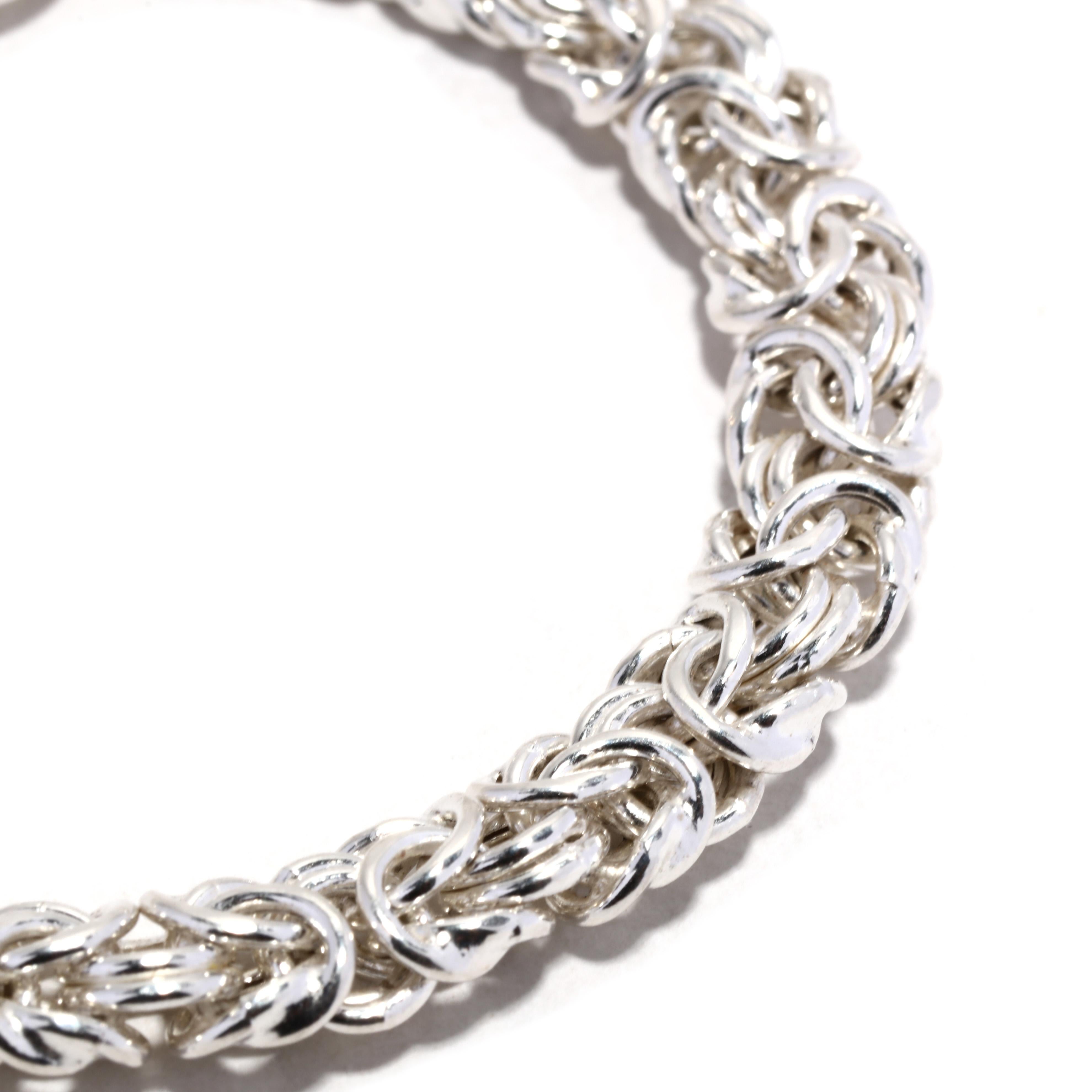 This stunning vintage Italian Byzantine chain bracelet is crafted from sterling silver and features a length of 7.25 inches. Its intricately linked chain pattern adds a beautiful, timeless touch to any wardrobe. With its classic Italian silver