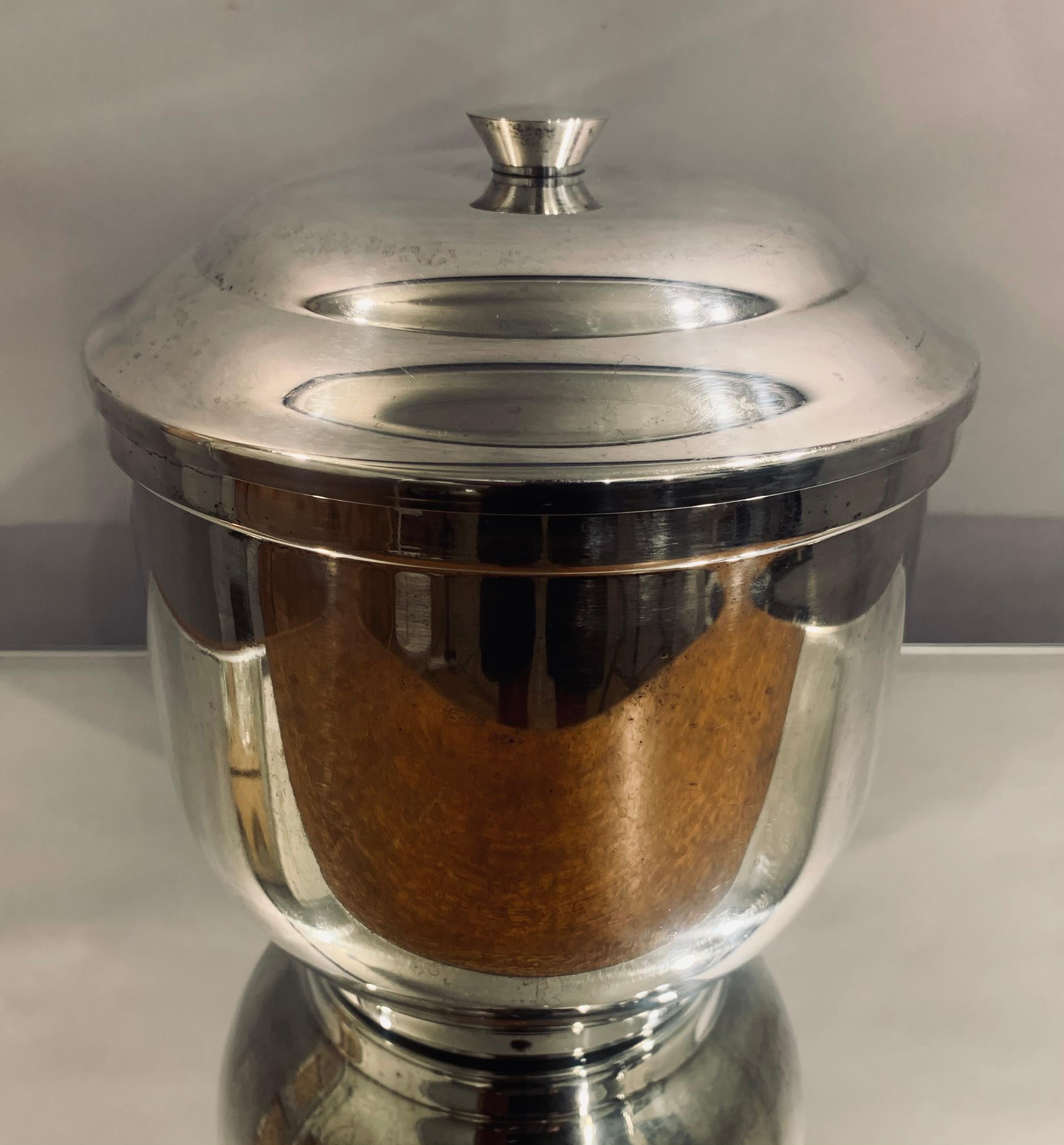 Vintage, circa 1950s, Italian silver-plated ice bucket with a white ceramic insert to hold the ice. The ceramic insert is held securely in place with a rubber air tight band around its circumference. Stamped on the base - Calegaro silver plated. The