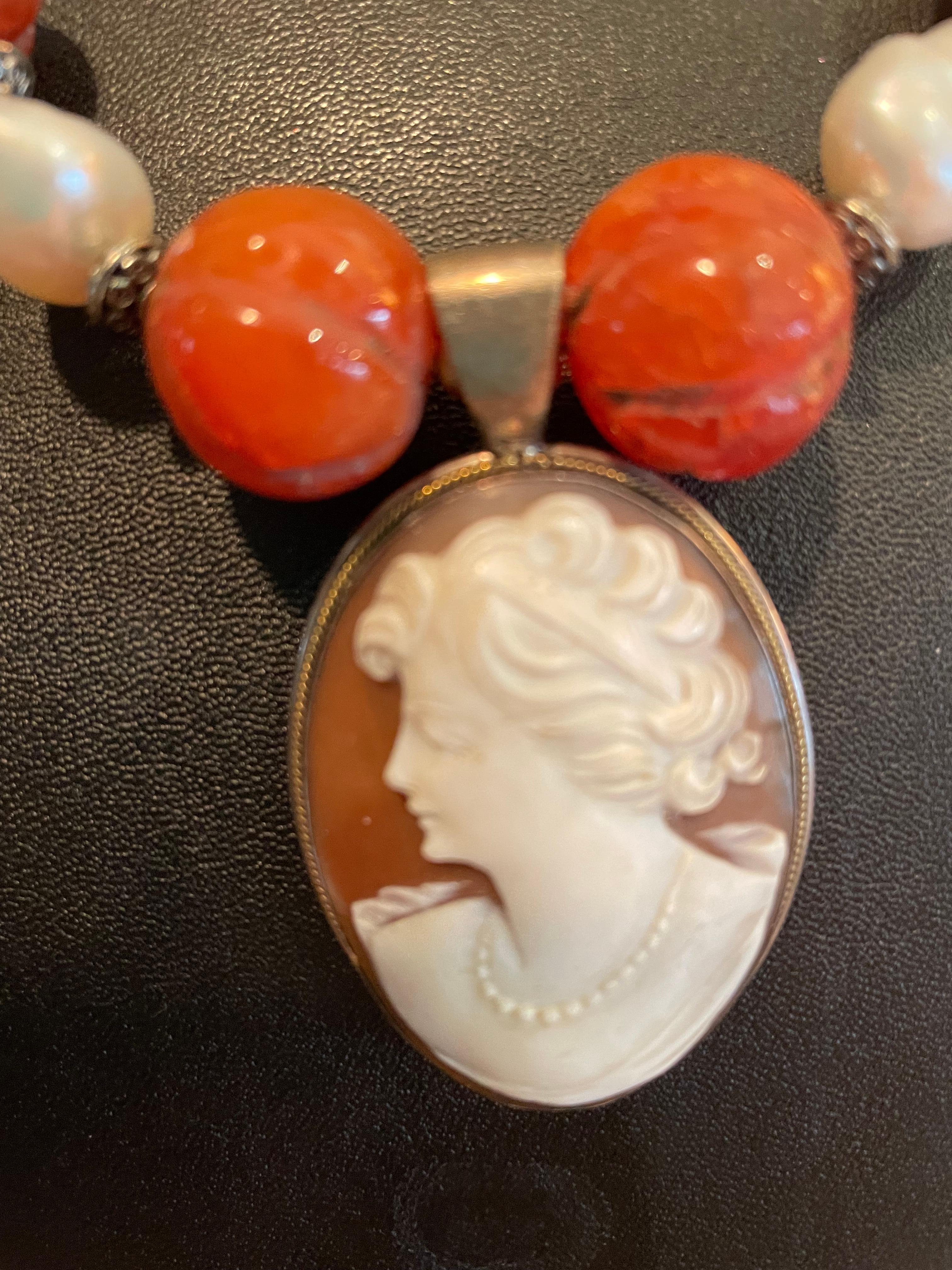 Vintage Italian cameo pendant on a string of baroque pearls,carved, vintage,carnelian,melon beads, This one of a kind ,handmade,statement necklace is on offer from Lorraine’s Bijoux.Sterling silver spacers and peacock coin pearls finish this piece.