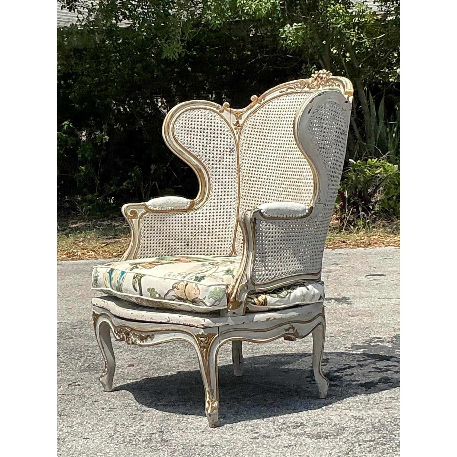 This exquisite vintage Italian wingback chair seamlessly blends Old-World craftsmanship with sophisticated comfort. Featuring a gracefully curved silhouette and handwoven cane detailing, this piece exudes European charm while the premium Hackney