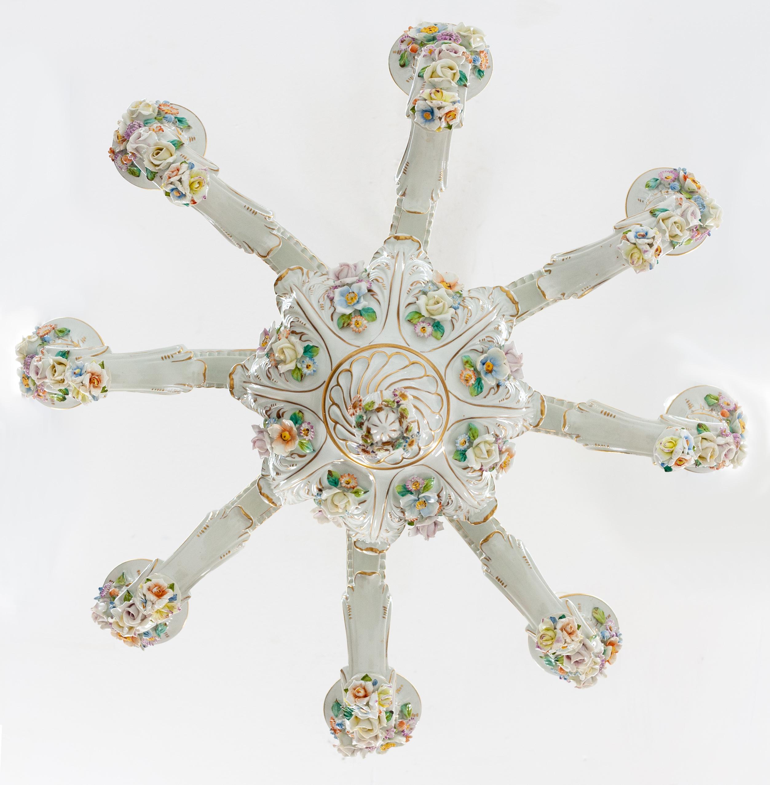 Beautiful Capodimonte raised floral porcelain chandelier. Eight arms. Signed marked with the crown mark S.P.A (SOCIETA’ PORCELLANE ARTISTICHE) Firenze, Italy. 1950s lovely colorful hand painted flowers. Rococo style. Professional rewired.

Overall