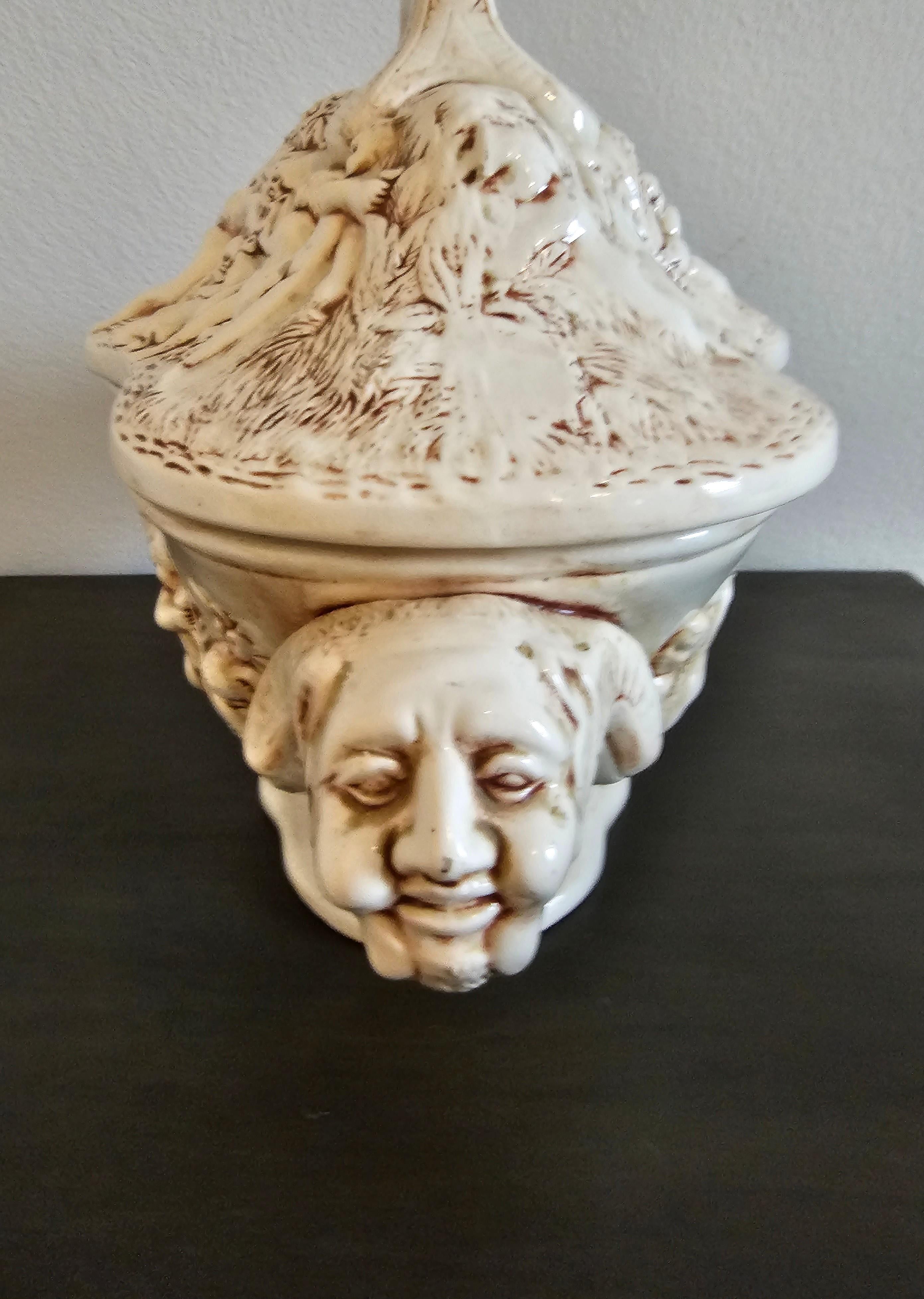 A large and magnificent vintage Italian Renaissance lidded Capodimonte style porcelain serving vessel (makes for a wonderful soup tureen or visually striking table centerpiece). 

The exceptionally executed scalloped shaped handled covered dish