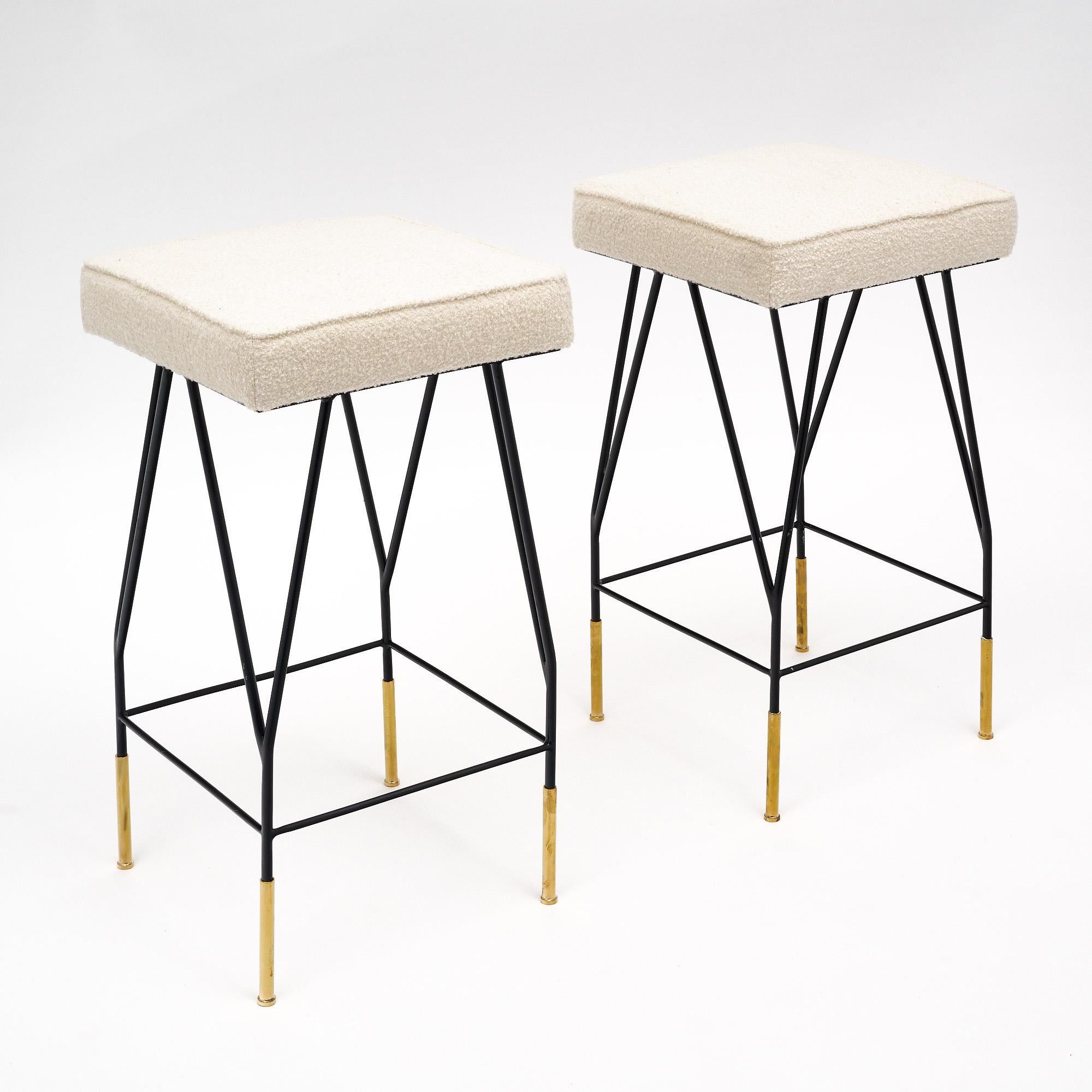 Pair of Italian barstools with black lacquered steel and brass legs. New upholstery is done in a white wool blend.
