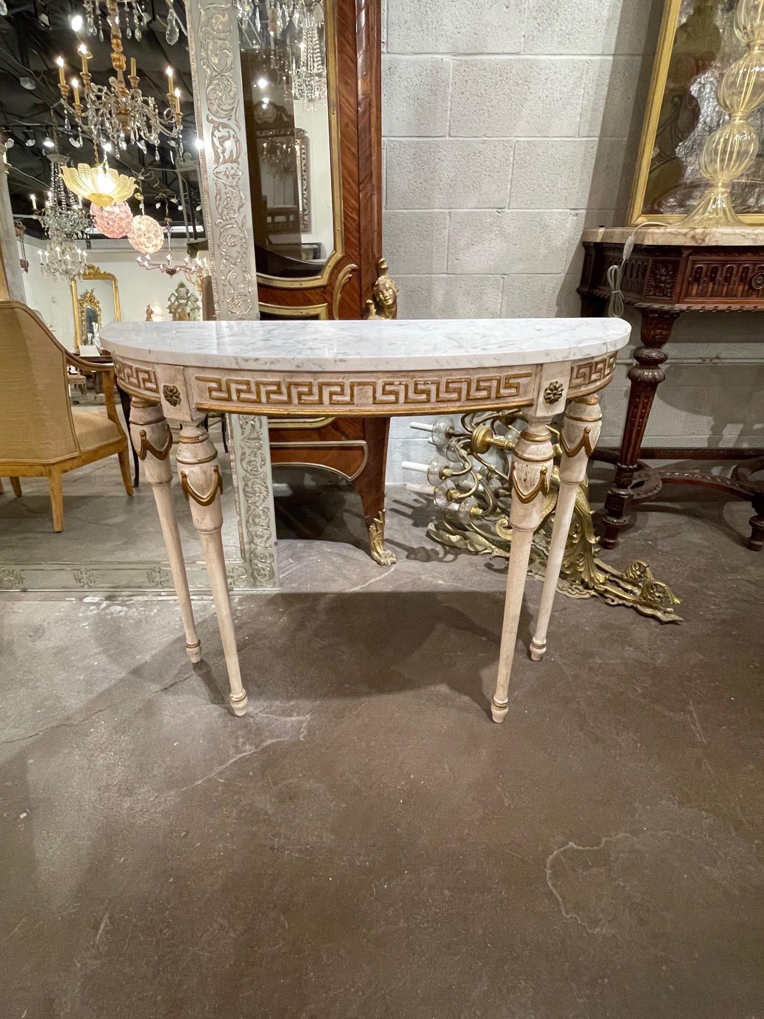 Beautiful vintage Italian carved and painted demi-lune table with Greek Key pattern and a carrara marble top. Fine quality and great for a smaller space. A very pretty classic!
