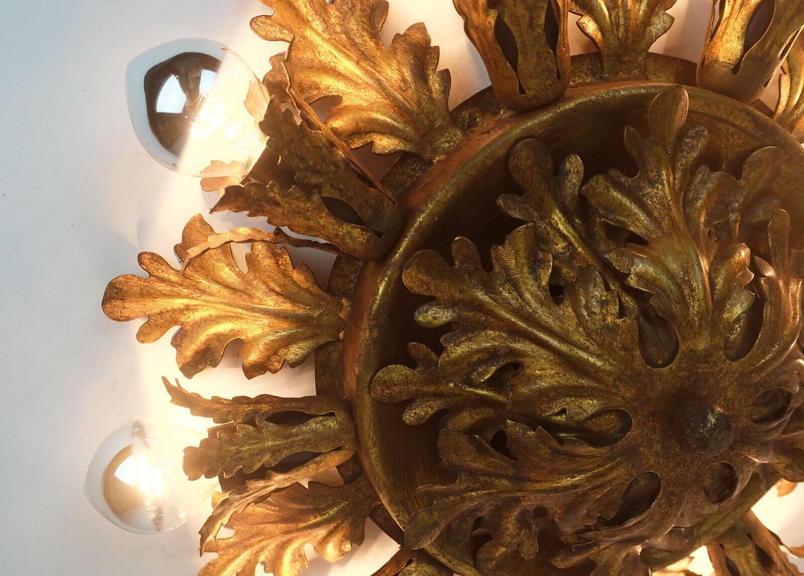 Very beautiful and decorative Florentine ceiling lamp. Opulently crafted with metal leaves, the color is a warm golden bronze tone. Italian production, most probably made by Banci in the 1960s. Hold 9 sockets for E14 light bulbs. You can use all