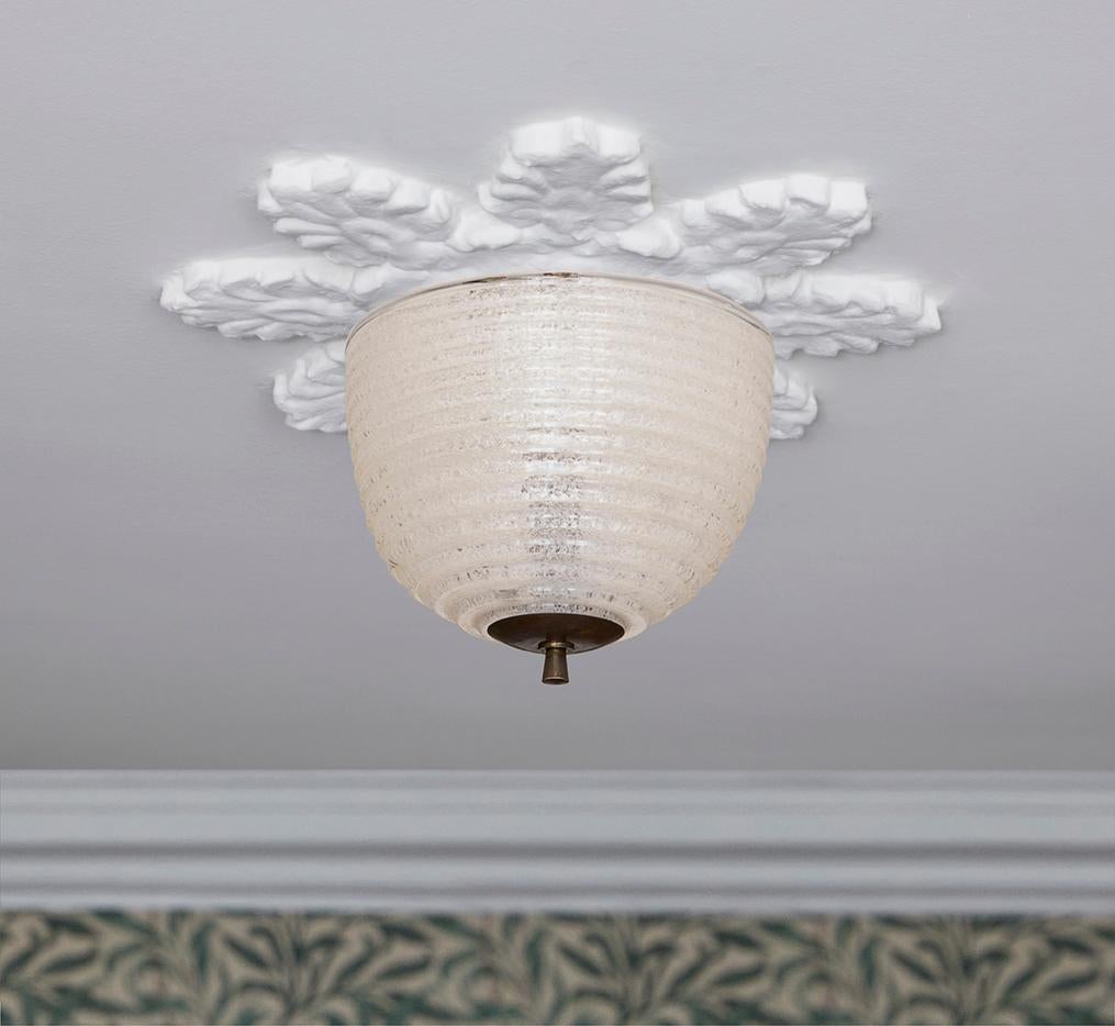 Lovely Italian ceiling light in tinted clear swirled glass with brass fitting.