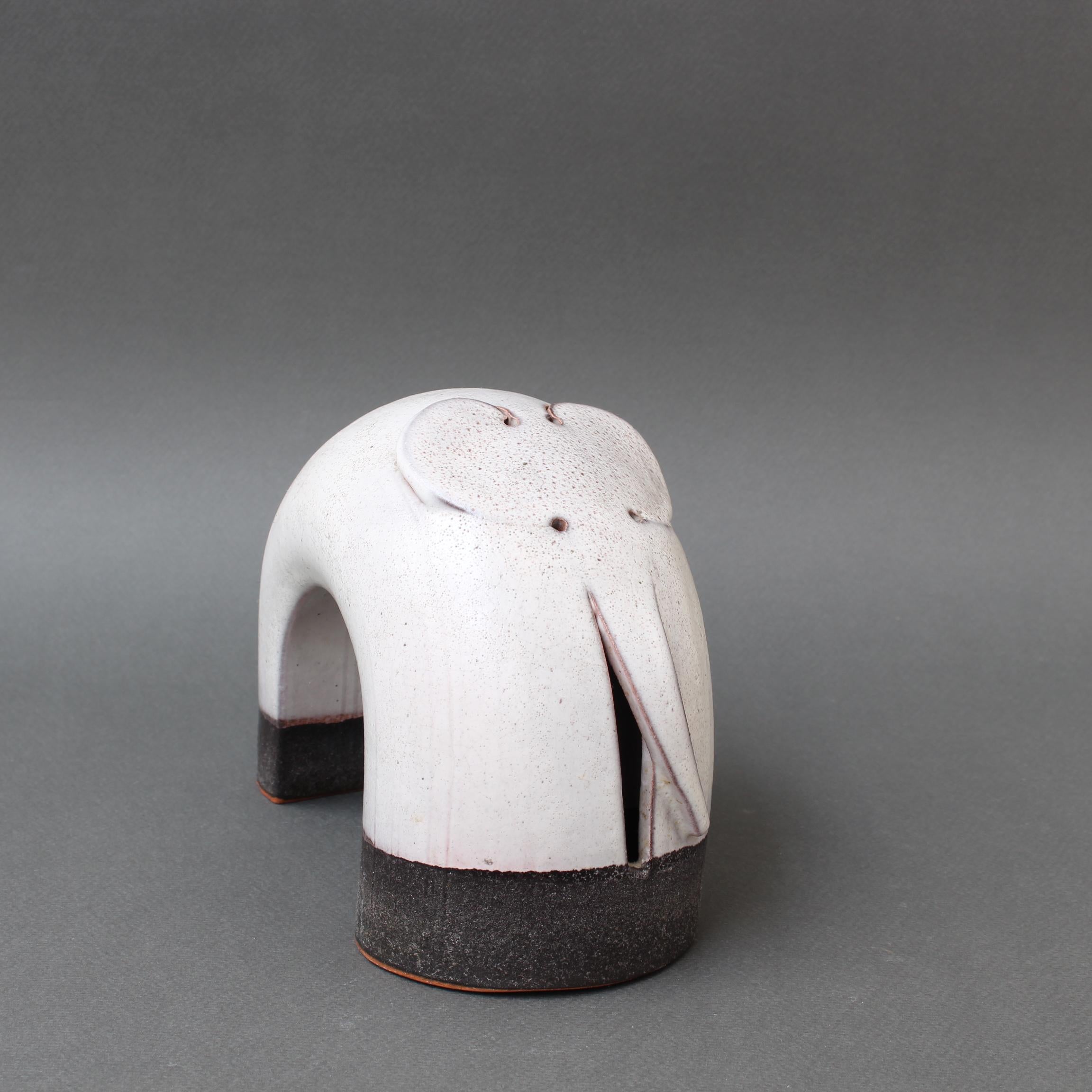 Vintage Italian ceramic elephant sculpture by Alessio Tasca (circa 1970s). This endearing, minimalist ceramic elephant is of the Italian school style likely inspired by the works of his compatriot, Bruno Gambone (1936-2021). Combining curves, play-