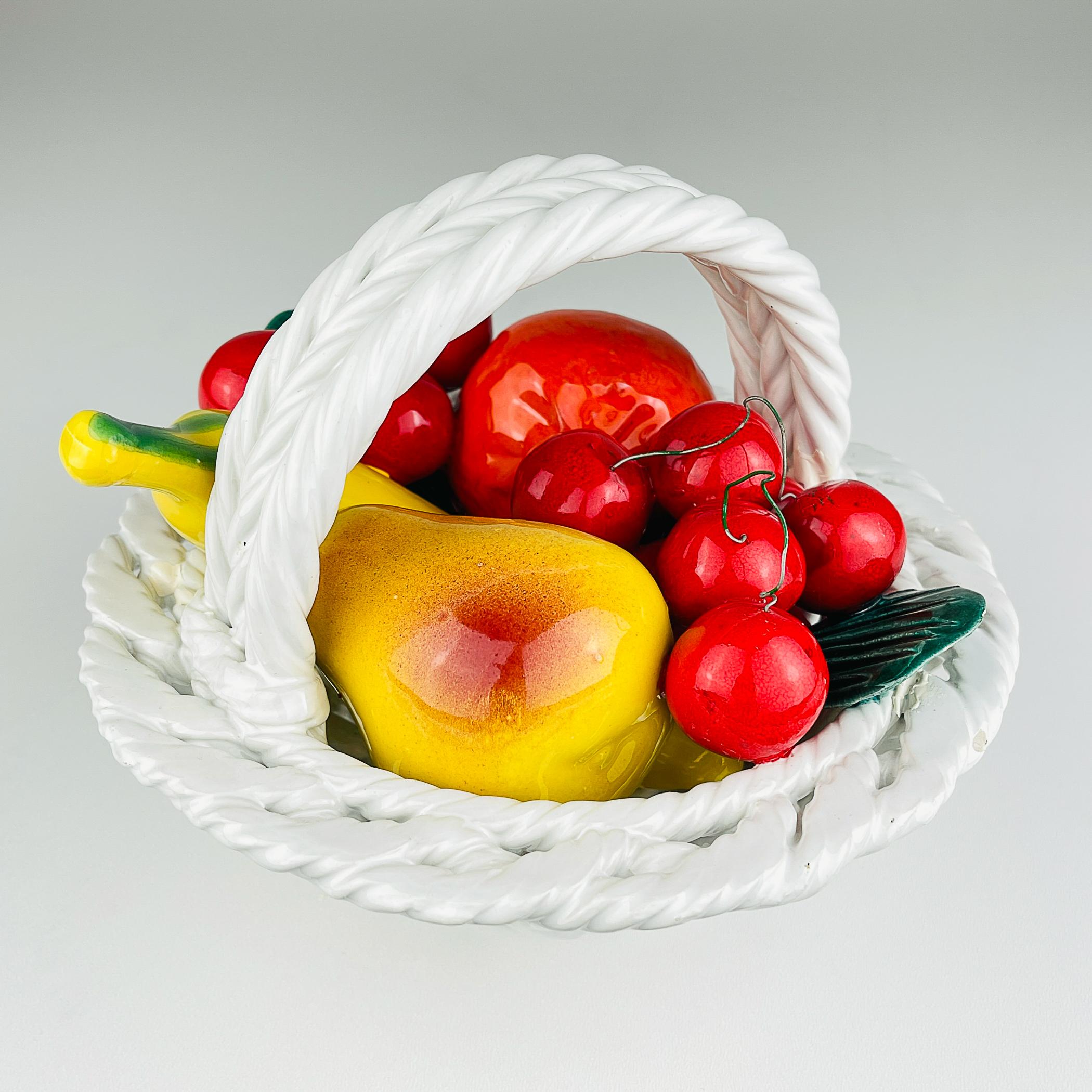Beautiful vintage ceramic fruit basket made in Italy in mid 20th century.
Cherry, banana, apple, pear are shiny and look yummy !

The vase is in very good vintage condition, one leaf has a chip.
Dimensions:
Width: 20 cm / 7,87 inches
Height: 15 cm /