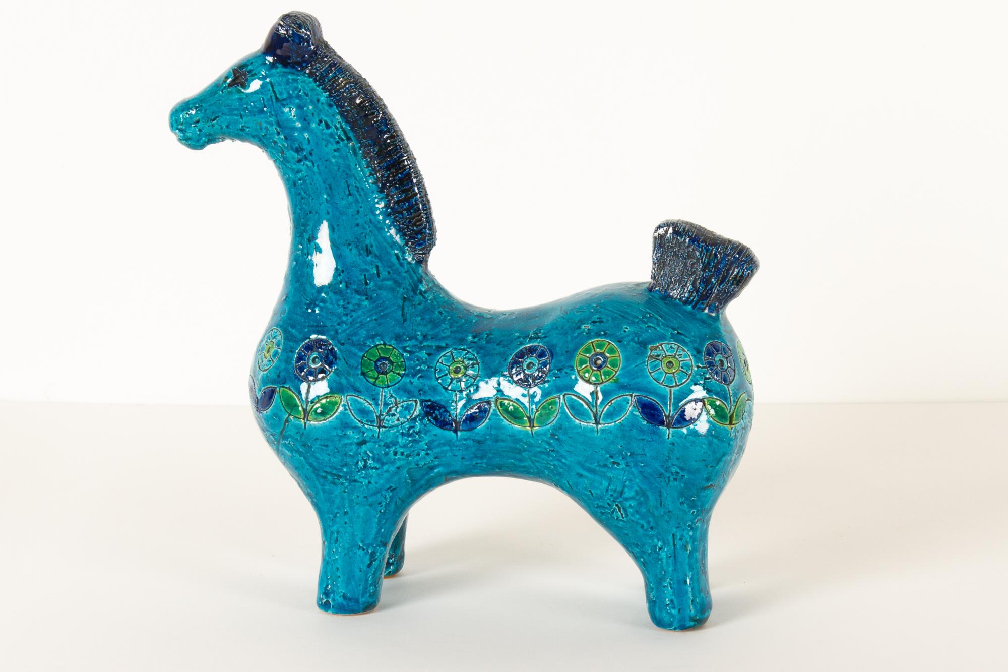 Vintage Italian ceramic horse figurine by Aldo Londi for Bitossi 1960s
Rare Italian Mid-Century Modern horse sculpture in Rimini blue glace with floral pattern created by Aldo Londi. This particular figurine is not often seen but is has the very