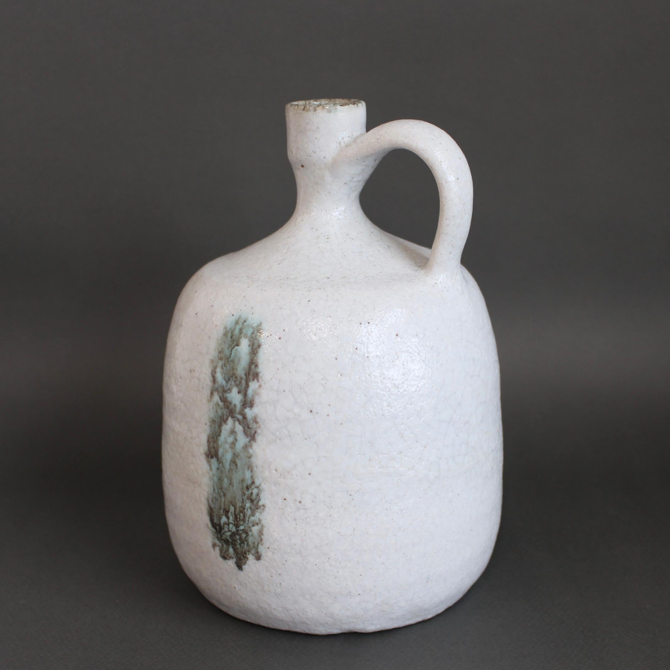 Italian ceramic decorative jug by Bruno Gambone (circa 1970s). The vessel has a purity of form, muted colour and demonstrated effortless beauty that is only created by Bruno Gambone. He transforms earthenware ceramics into works of art. With its